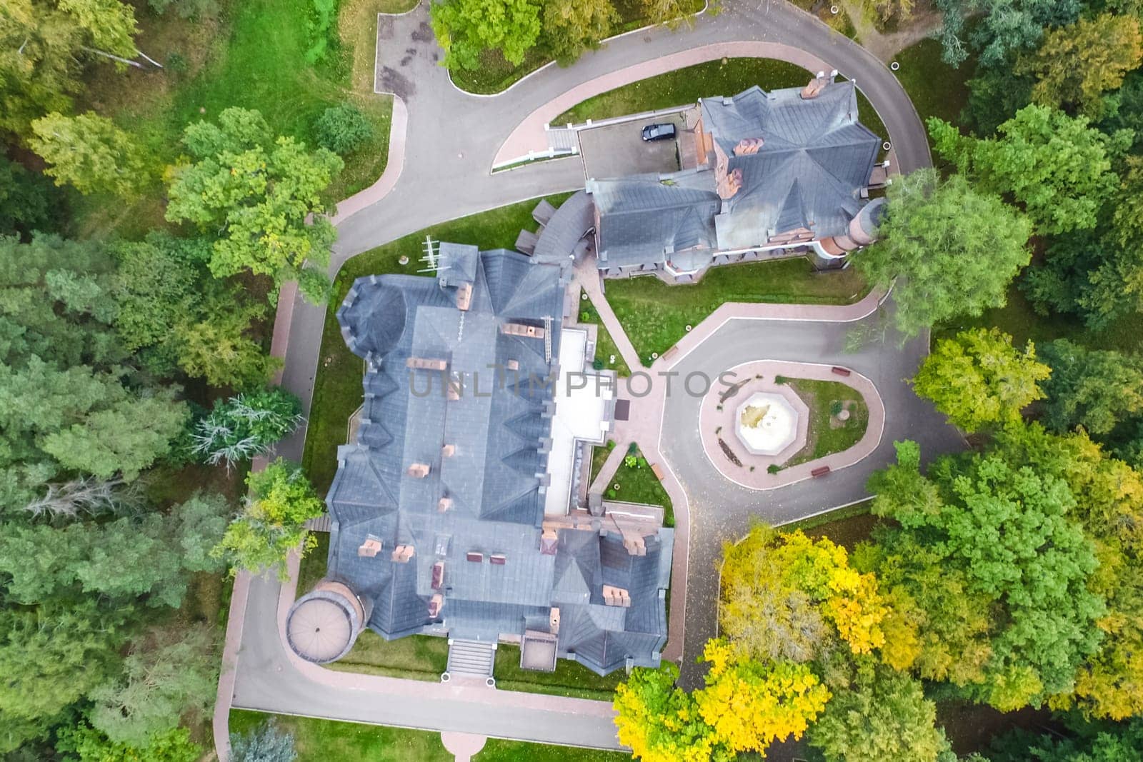 Castle in Moscow in the park. A modern Moscow castle surrounded by trees