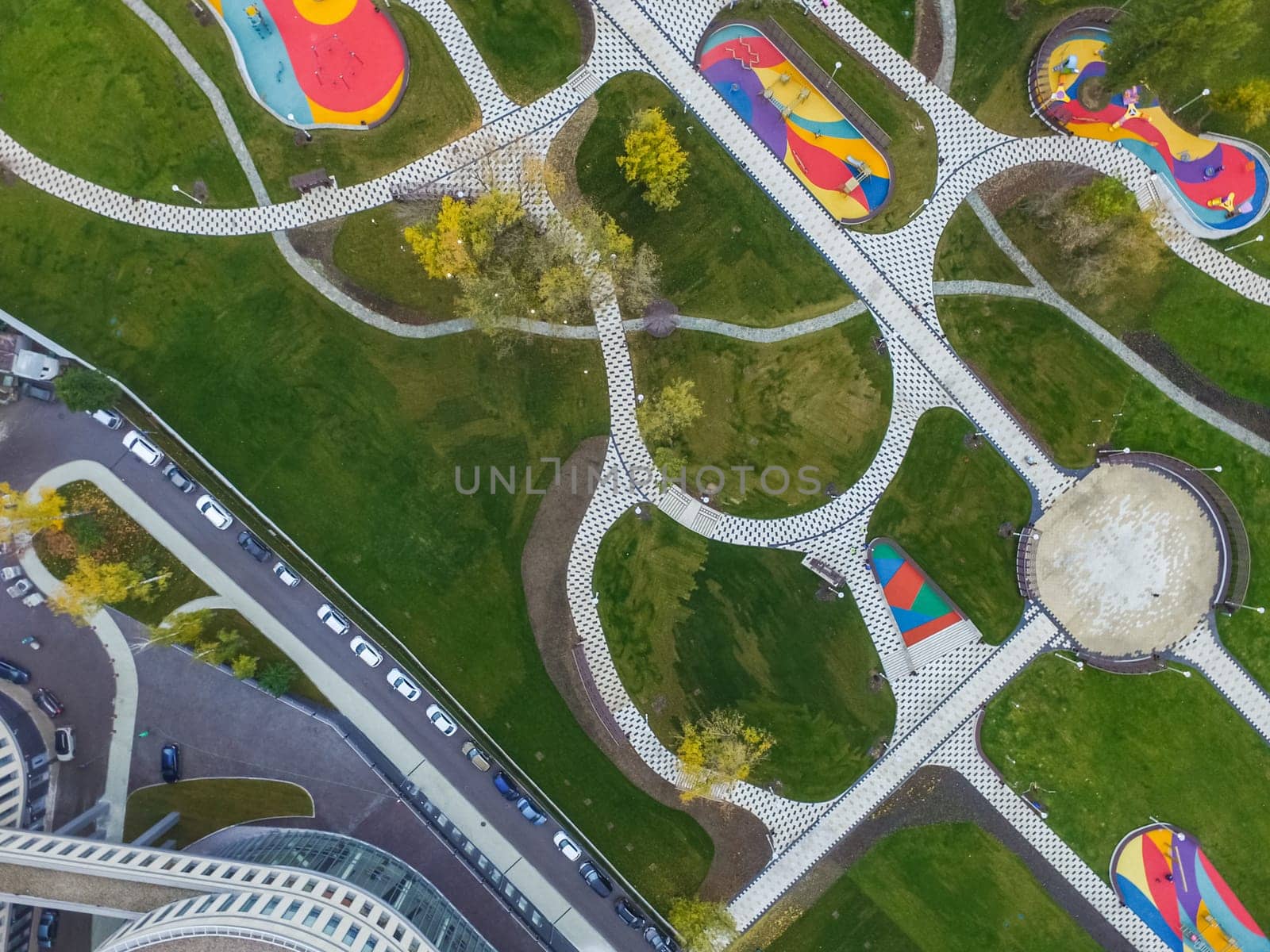 Paths in the park of paving slabs, top view of the city park