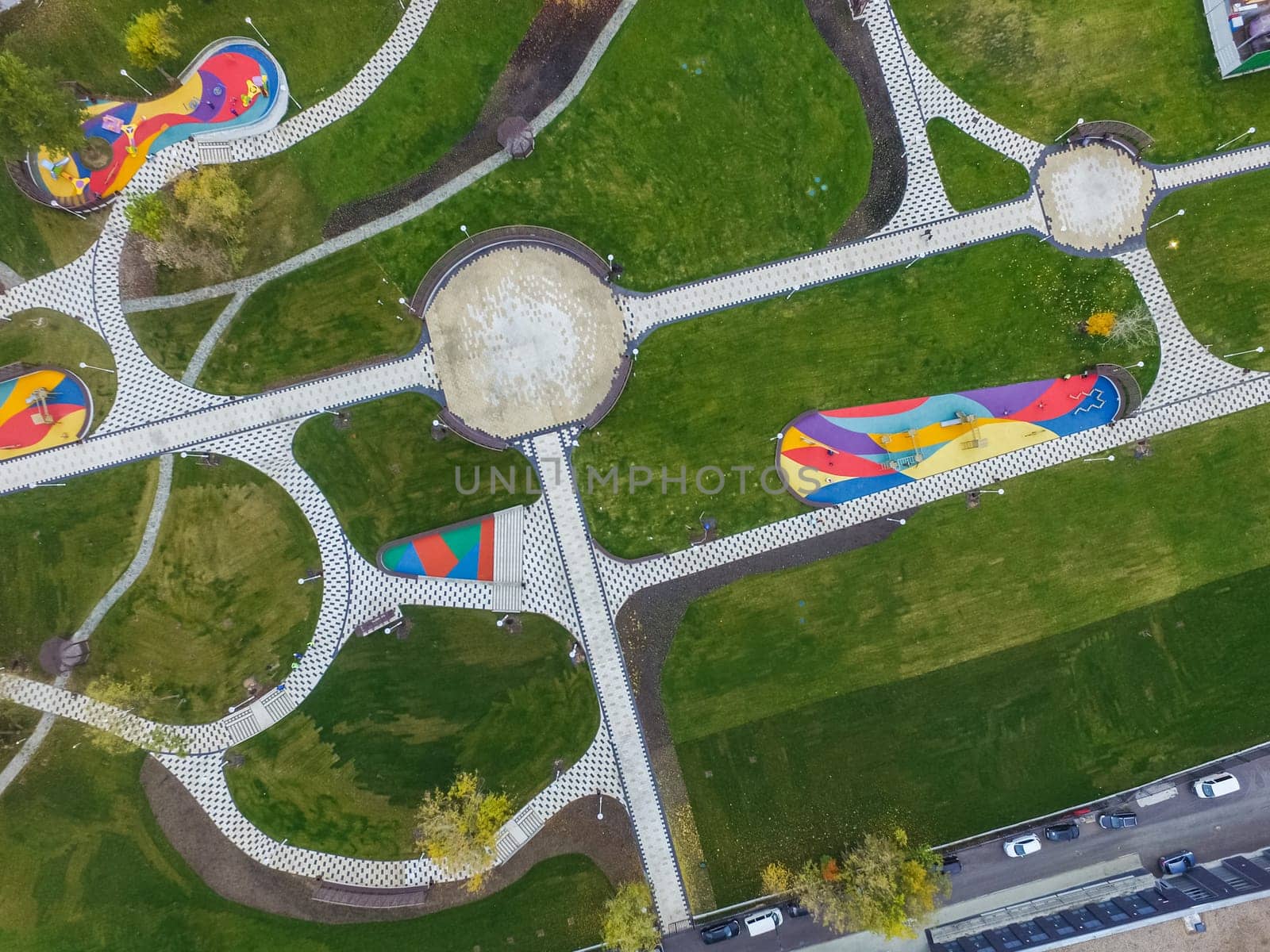 Paths in the park of paving slabs, top view of the city park