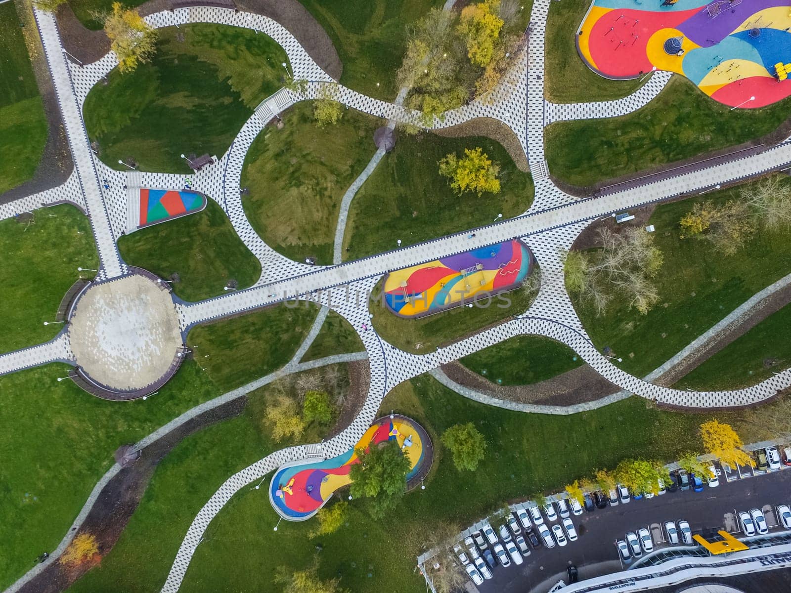 Paths in the park of paving slabs, top view of the city park