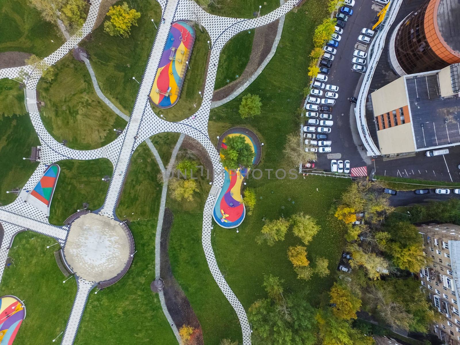 Paths in the park of paving slabs, top view of the city park
