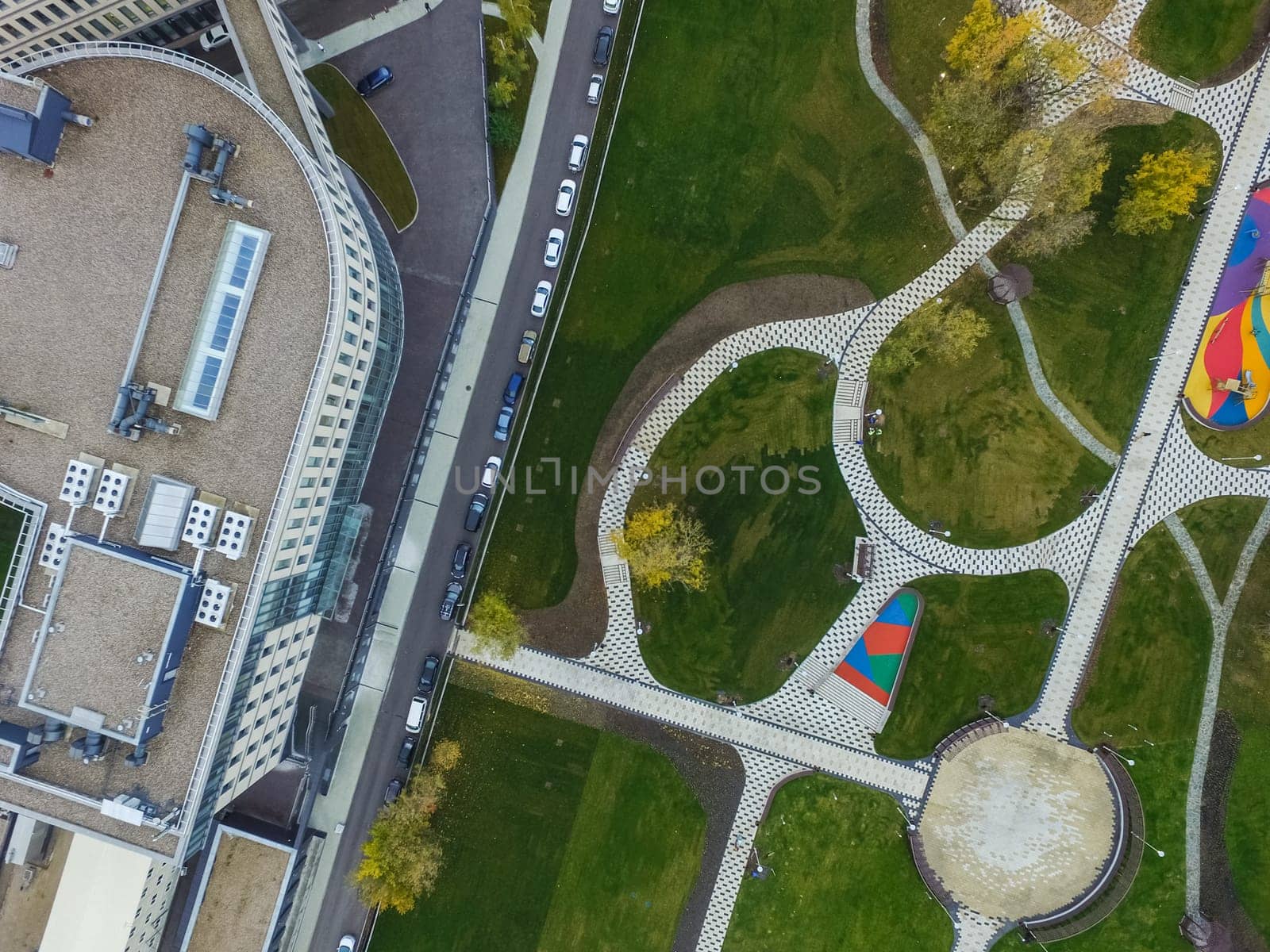 Paths in the park of paving slabs, top view of the city park