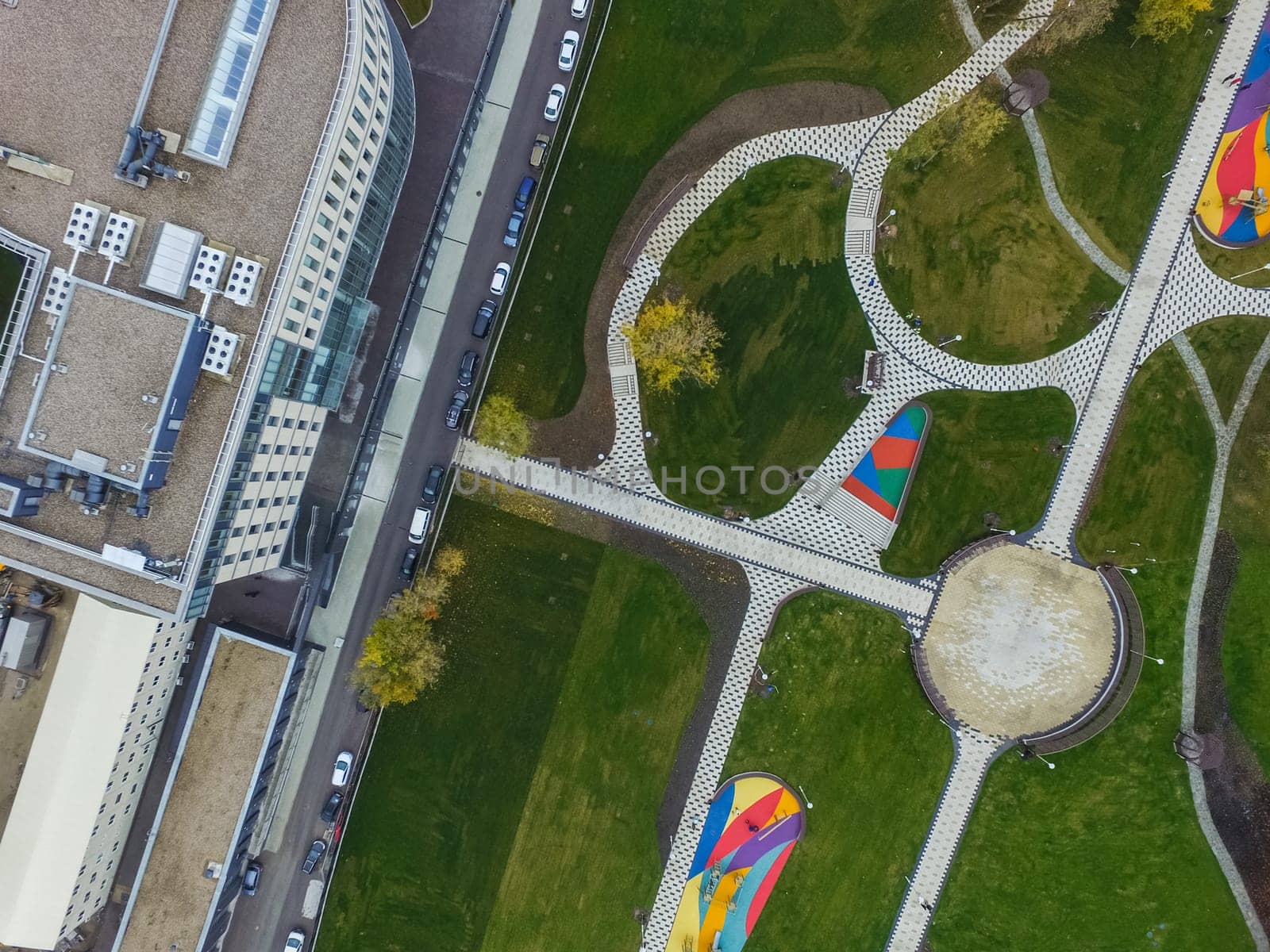 Paths in the park of paving slabs, top view of the city park