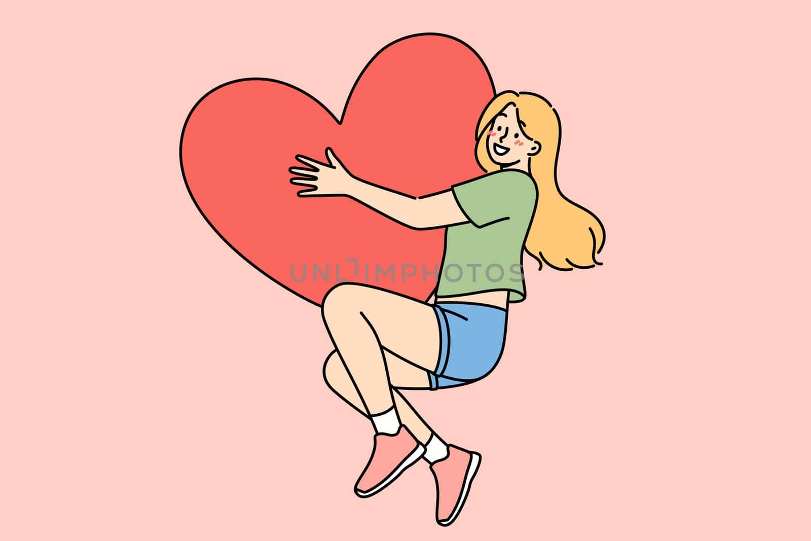Happy teenage girl hugs large heart-shaped valentine card, rejoicing at coming of february holiday. Woman in love feels euphoria and romantic mood after receiving valentine day gift