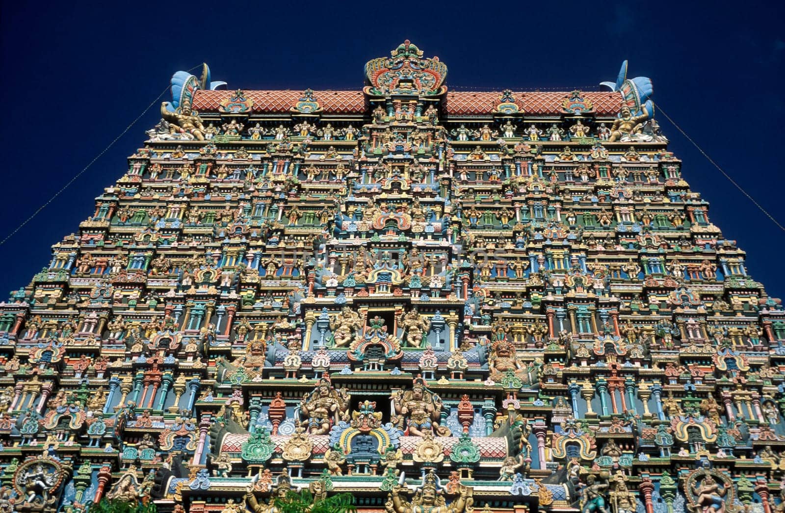 a view of the Tower of the Meenakshi Amman Temple in the city of Madurai in the Province Tamil Nadu in India.  India, Madurai, April, 1998