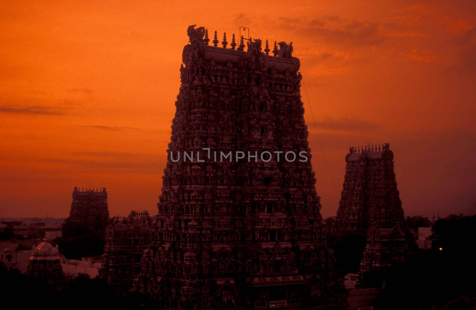 a view of the Tower of the Meenakshi Amman Temple in the city of Madurai in the Province Tamil Nadu in India.  India, Madurai, April, 1998