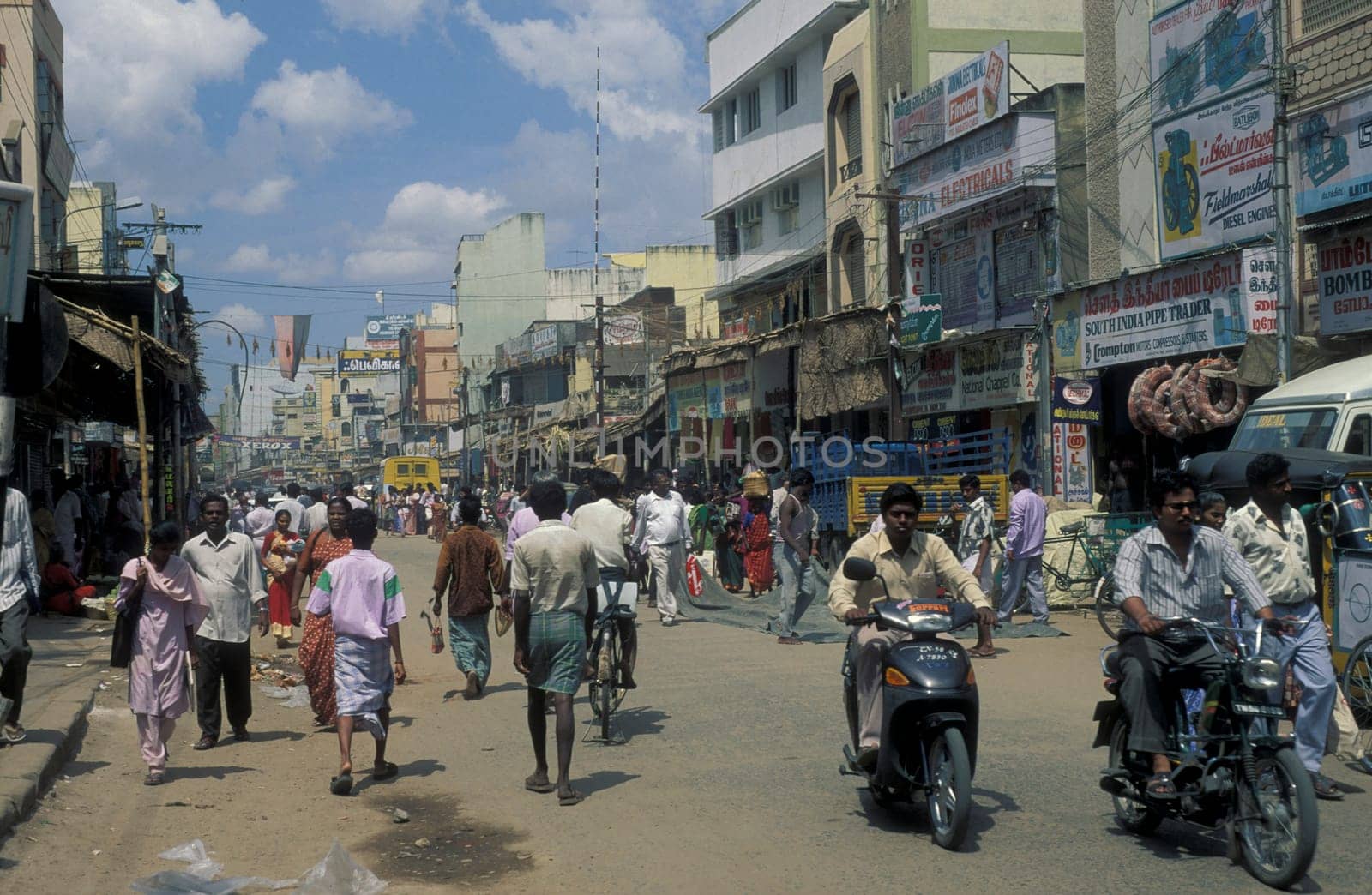 people in a street in the city of Madurai in the Province Tamil Nadu in India.  India, Madurai, April, 1998