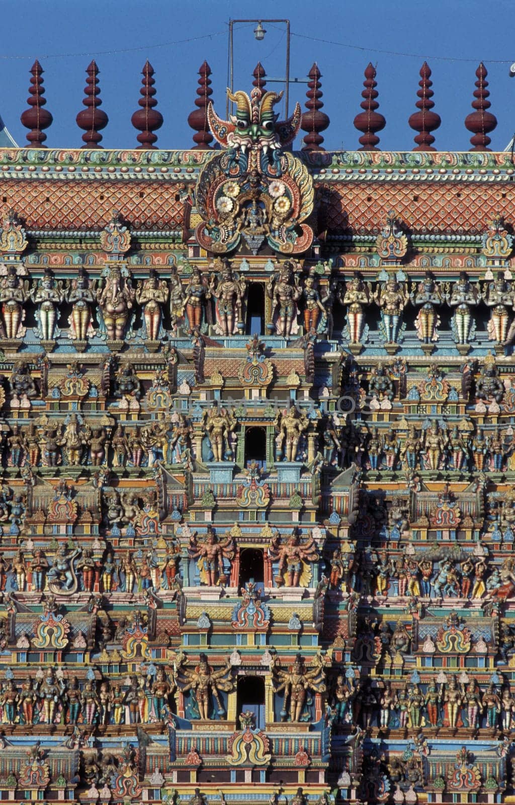 Hindu carving figures at a Tower of the Meenakshi Amman Temple in the city of Madurai in the Province Tamil Nadu in India.  India, Madurai, April, 1998
