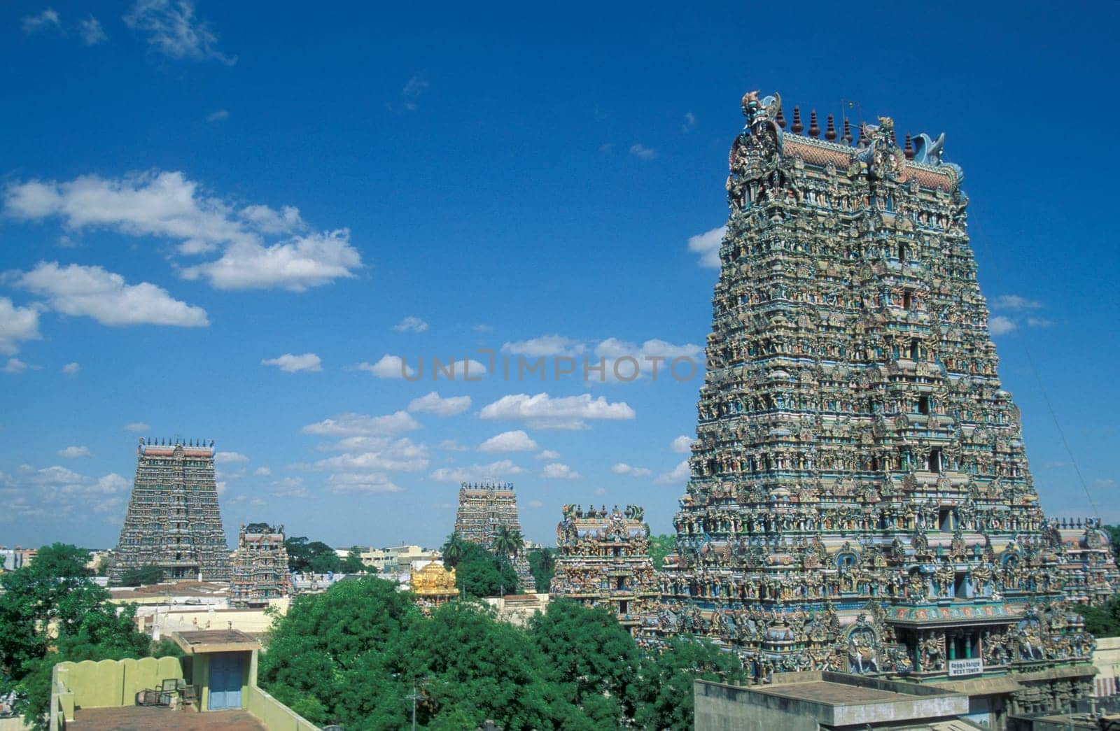 a view of the Tower of the Meenakshi Amman Temple in the city of Madurai in the Province Tamil Nadu in India.  India, Madurai, April, 1998