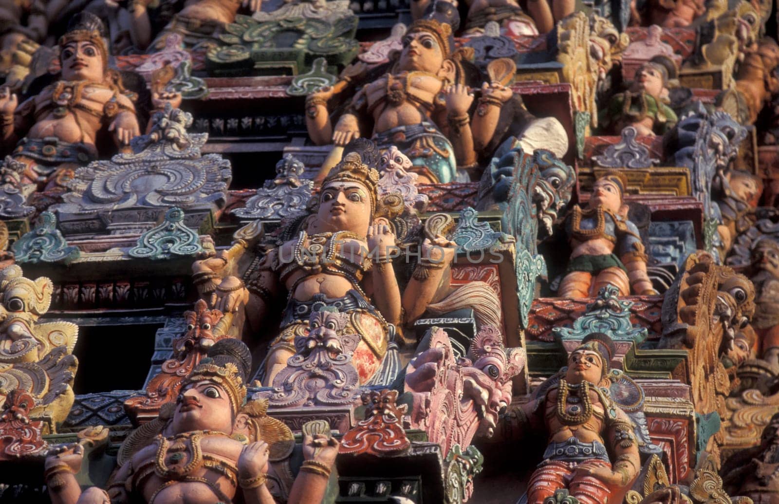 Hindu carving figures at a Tower of the Meenakshi Amman Temple in the city of Madurai in the Province Tamil Nadu in India.  India, Madurai, April, 1998