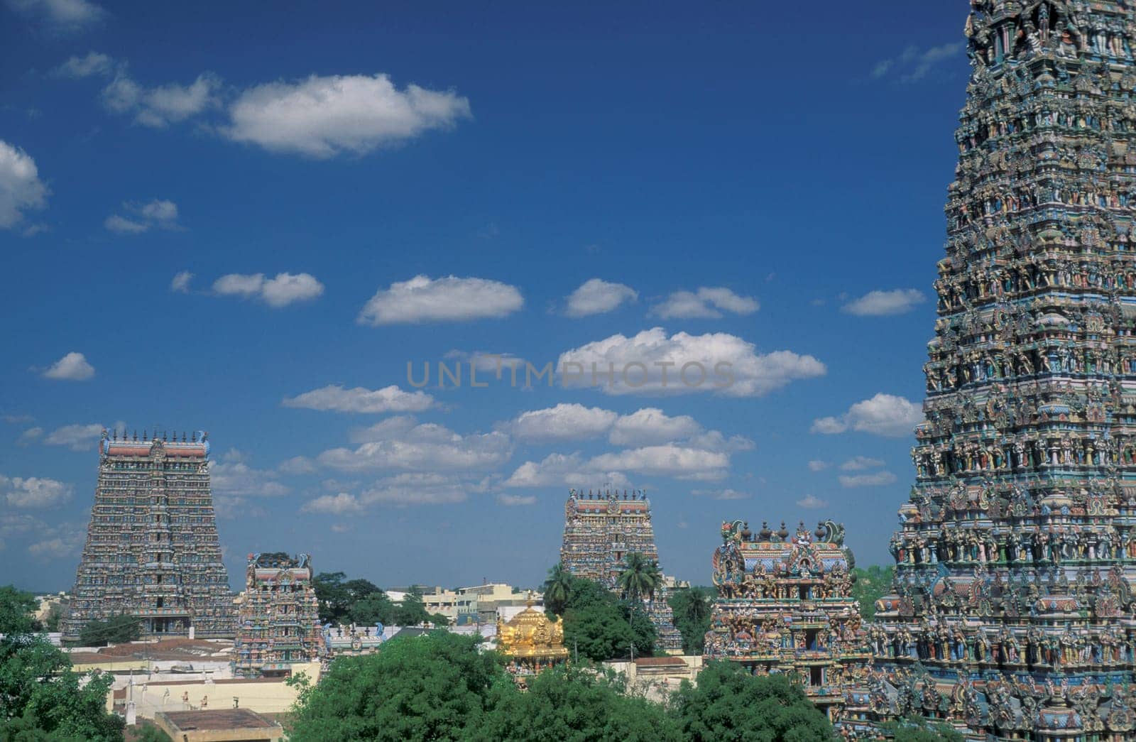 a view of the Tower of the Meenakshi Amman Temple in the city of Madurai in the Province Tamil Nadu in India.  India, Madurai, April, 1998