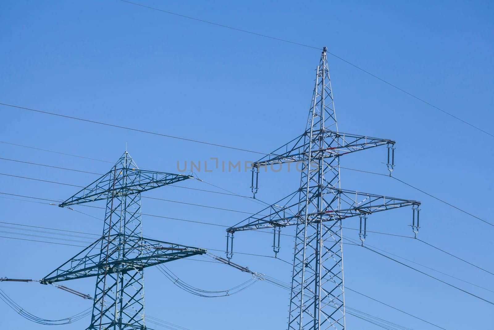 Electricity pylons on the River Este, Buxtehude, Lower Saxony, Germany