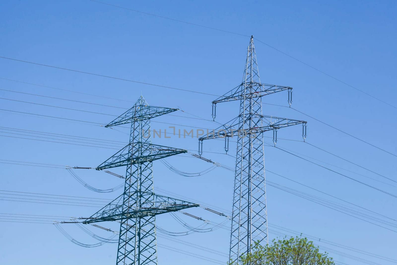 Electricity pylons on the River Este, Buxtehude, Lower Saxony, Germany