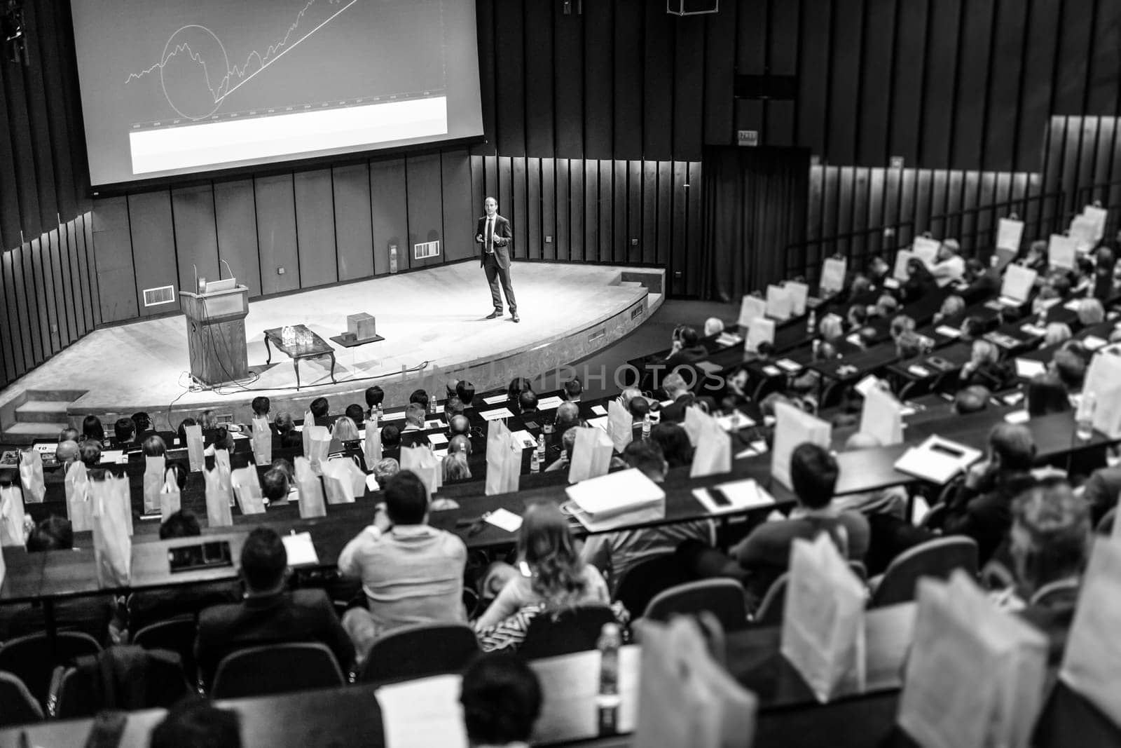 Speaker Giving a Talk at Business Meeting. Audience in the conference hall. Business and Entrepreneurship concept.