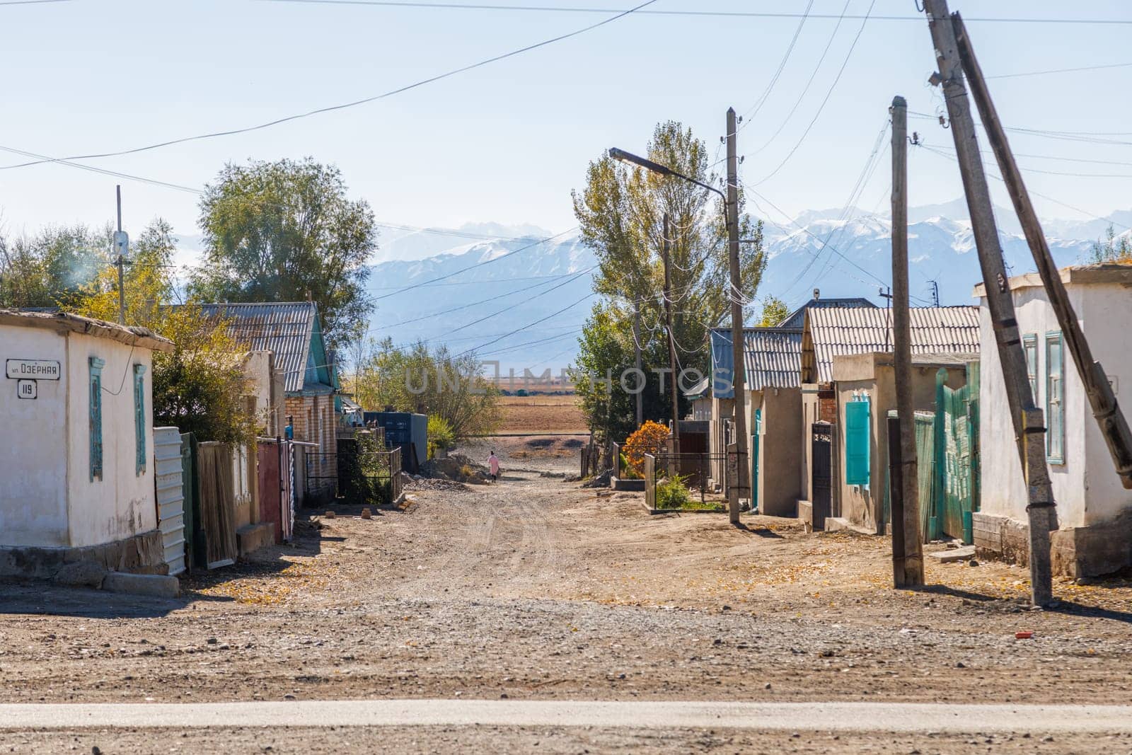 Streets of small Kyrgyz town at sunny autumn day in Balykchy, Kyrgyzstan- October 21, 2022