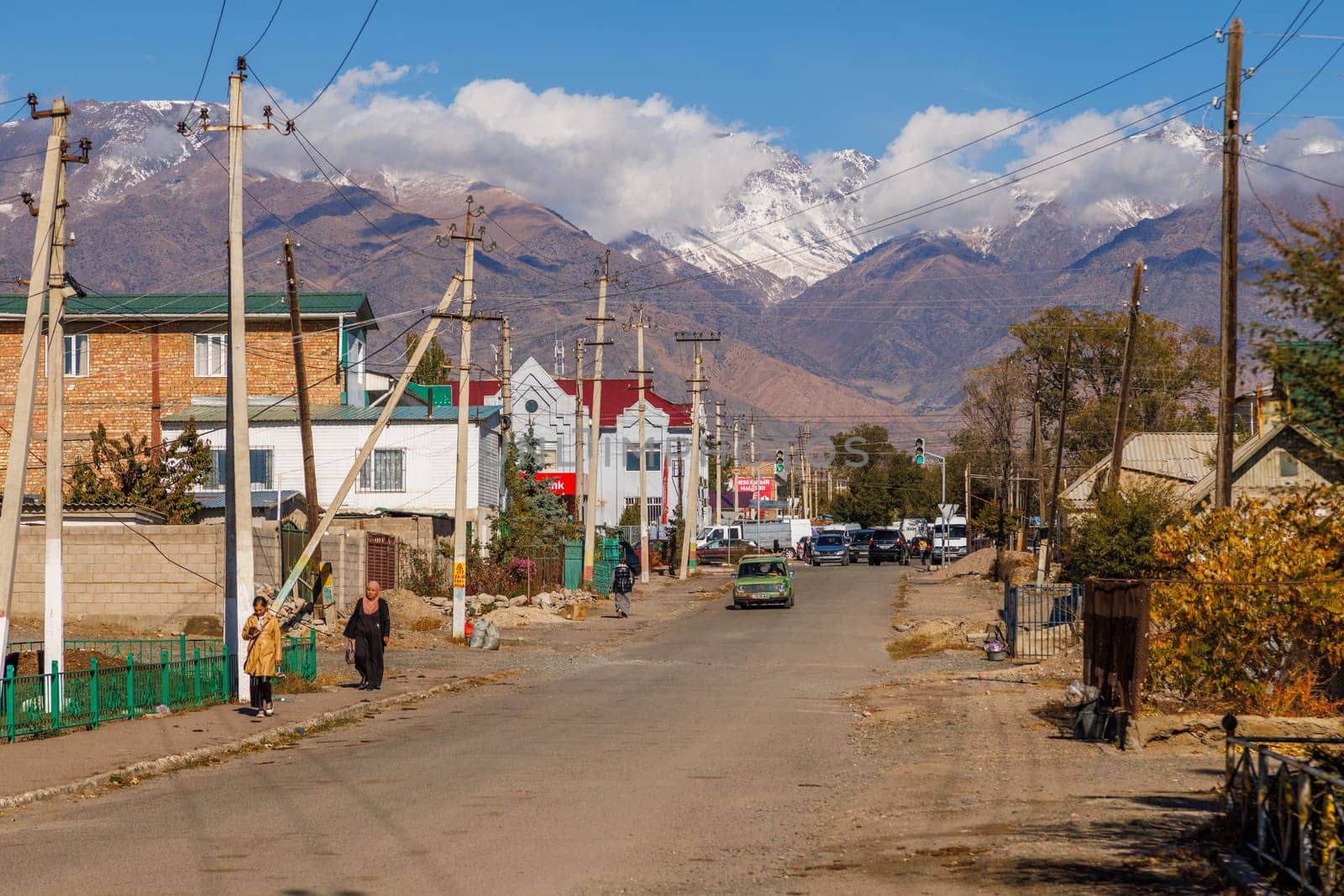 Streets of small Kyrgyz town at sunny autumn day in Balykchy, Kyrgyzstan- October 21, 2022