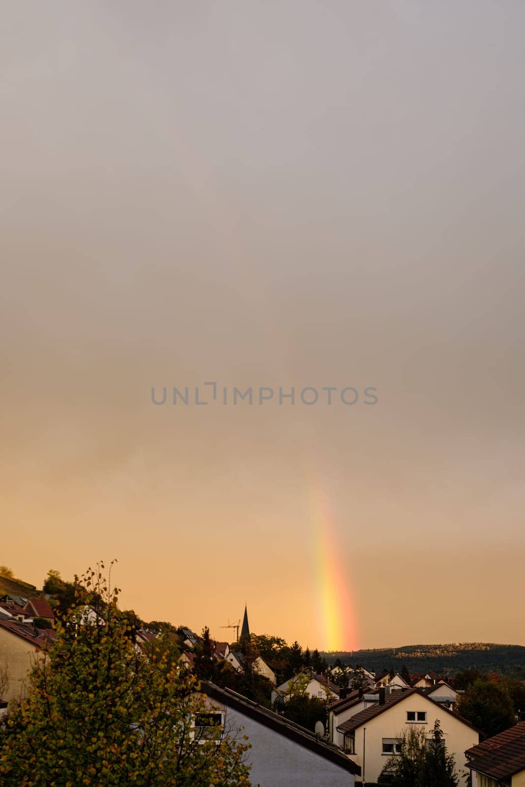 Rainbow weather over homes