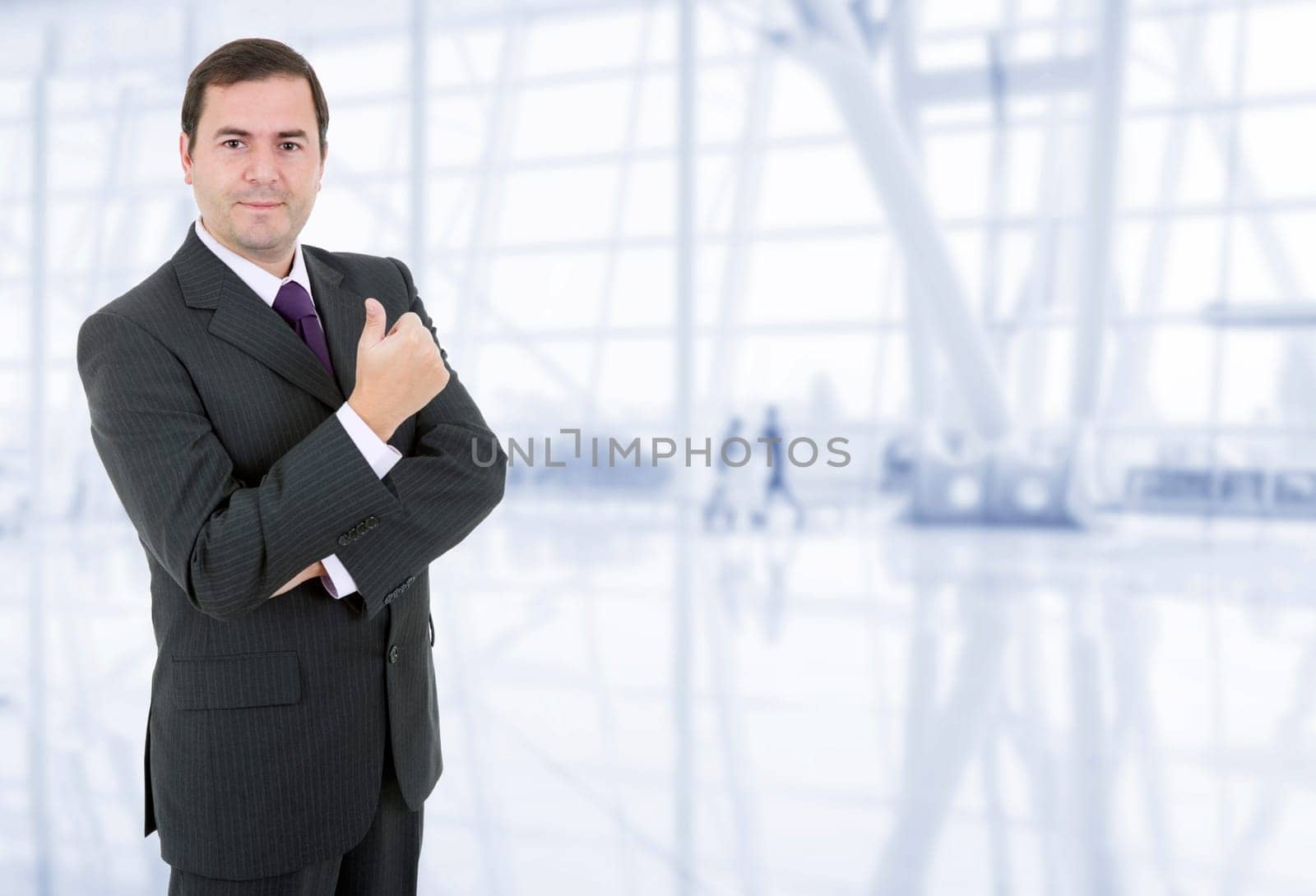 young business man going thumb up, at the office