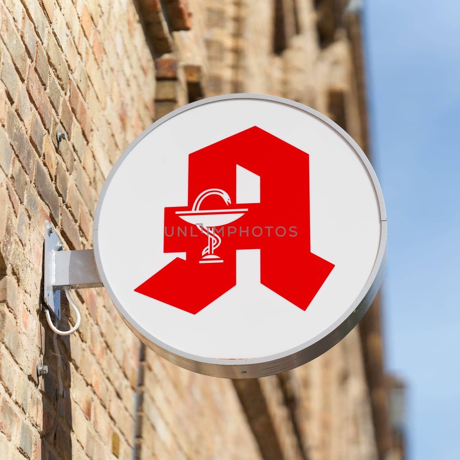 Illuminated sign of a pharmacy, for the supply of medicines in the city center of Magdeburg in Germany