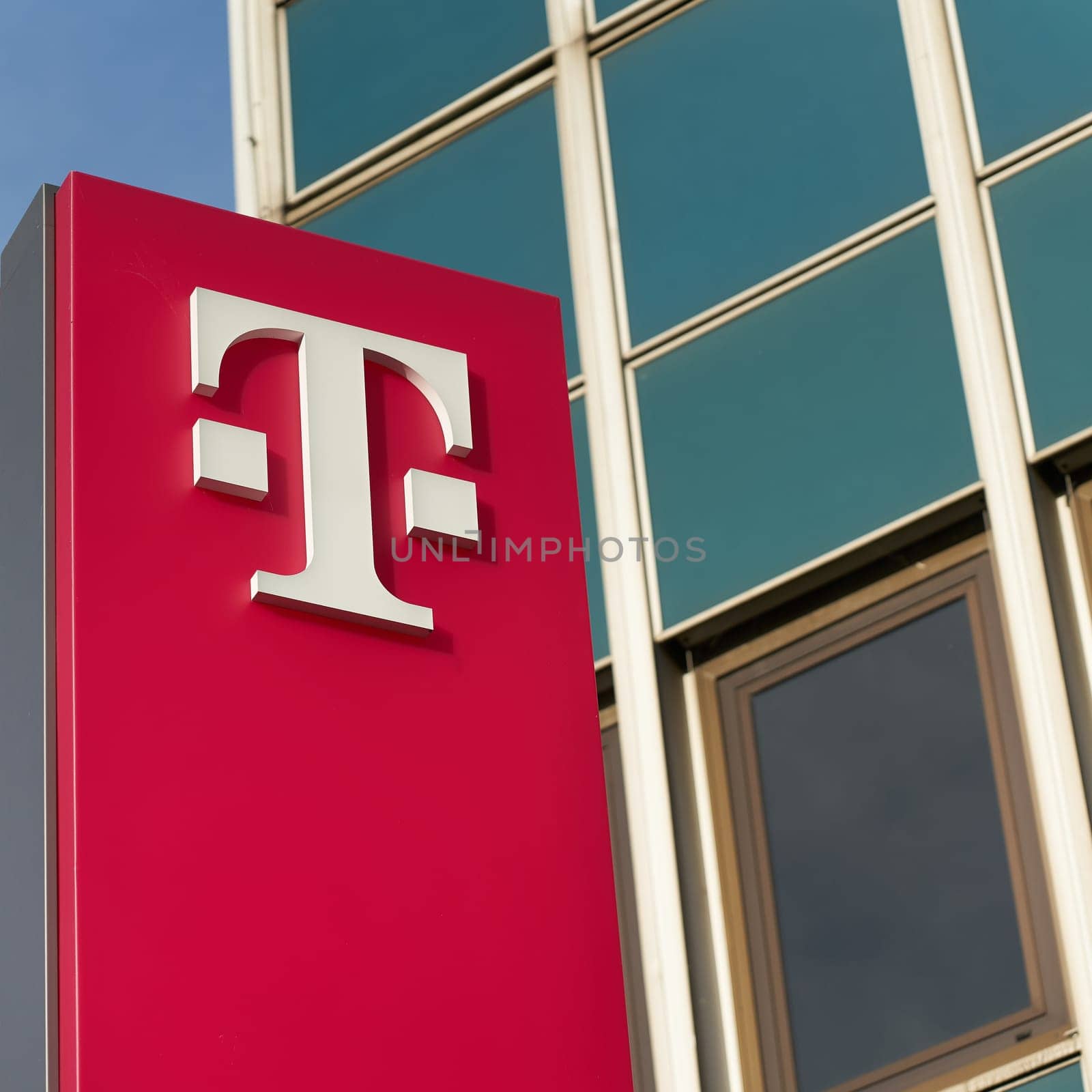 Logo of the Deutsche Telekom AG Group in front of a branch office in Magdeburg, Germany