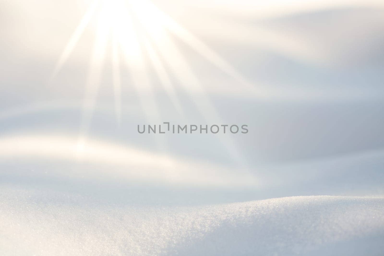 Light rays from the top enlightening the snow on the floor