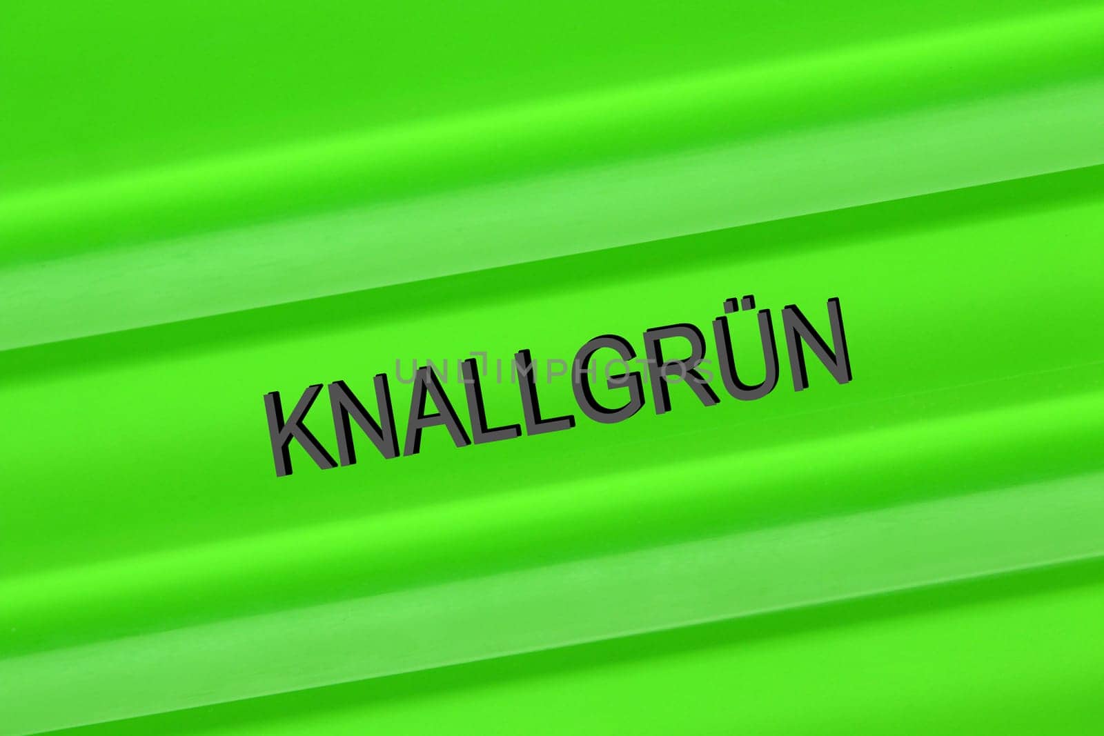 Close-up of a glass background with the inscription bright green