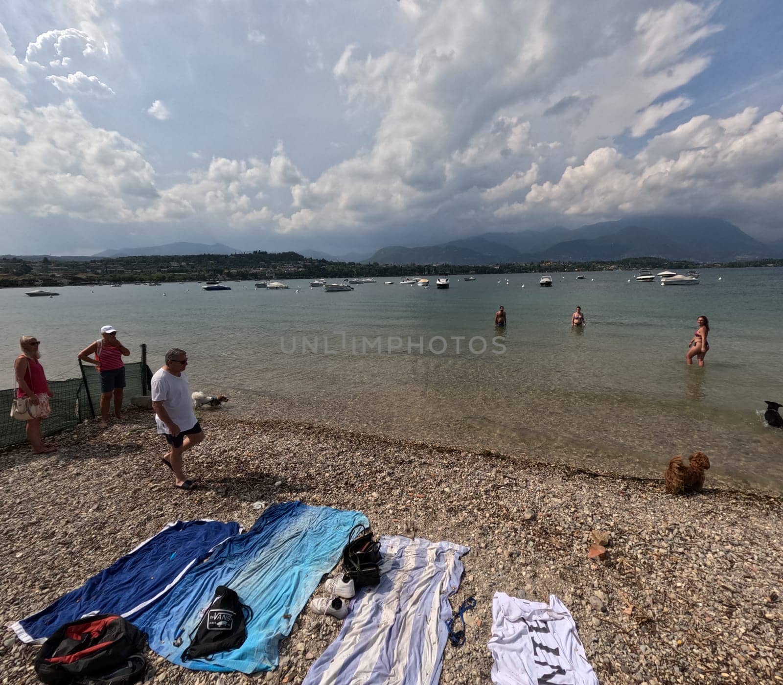 Tourists on the beach of Manerba del Garada on Lake Garda,in the neighboring town of Torri del Benaco,there was a large outbreak with the norovirus  Travel Photography - Lake Garda / Lago di Garda / Italy / Italy / Italia