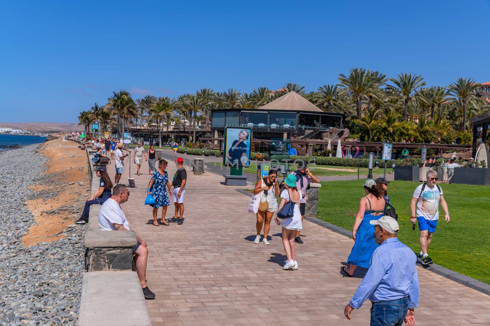Gran Canaria, Spain - March 20, 2024: People at the Maspalomas coast in Gran Canaria Canary Island.This an important tourist destination on the island