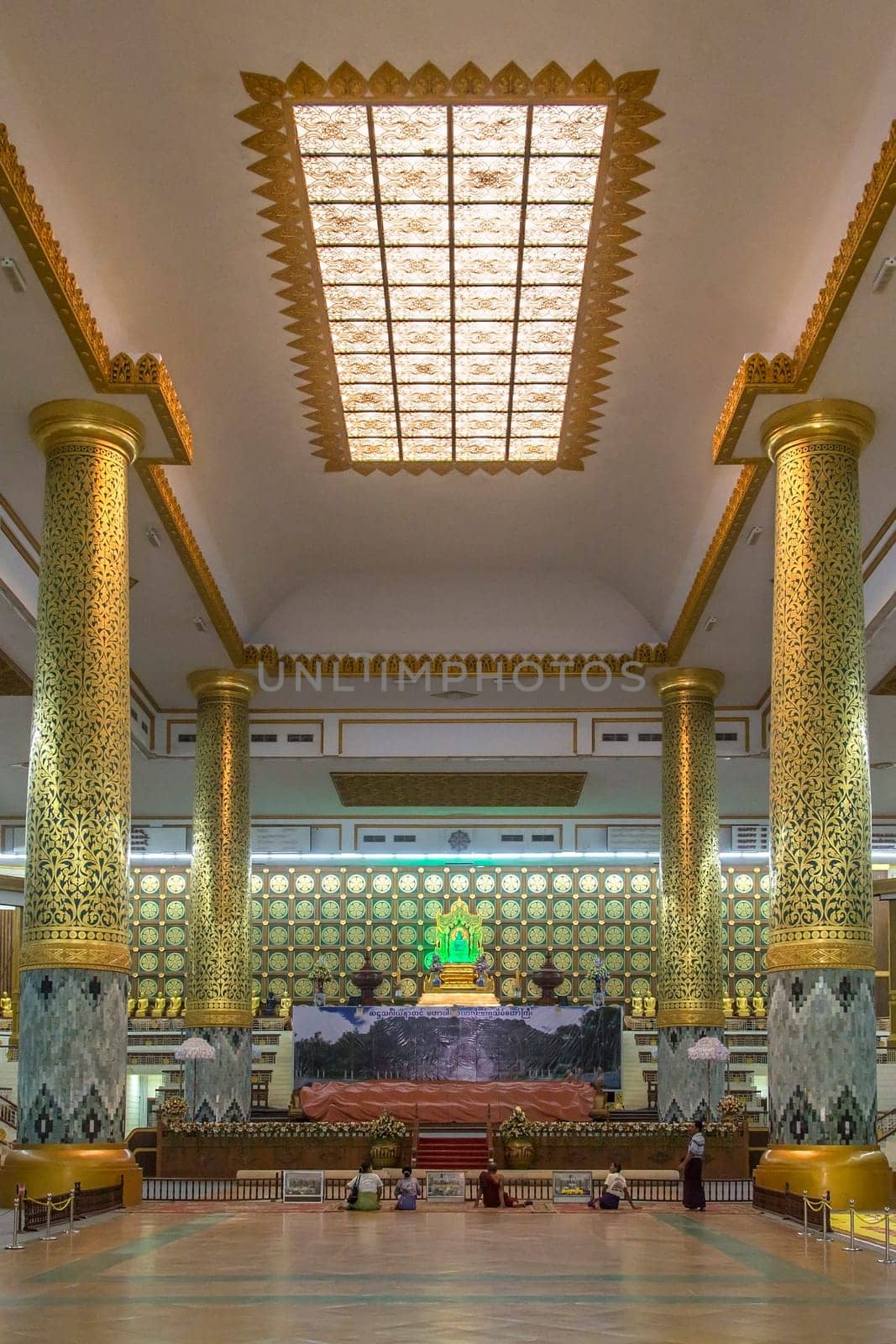 Interior of the Mahapasana Guha Cave and Buddhist Ordination Hall in Yangon, Myanmar. It is adjacent to the Kaba Aye Pagoda. Here, religious examination called the Tipitakadhara Tipitaka Kovida Examinations take place, an extensive recitation, oral and written examination on the Tipitaka, the religious body of works in Theravada Buddhism.