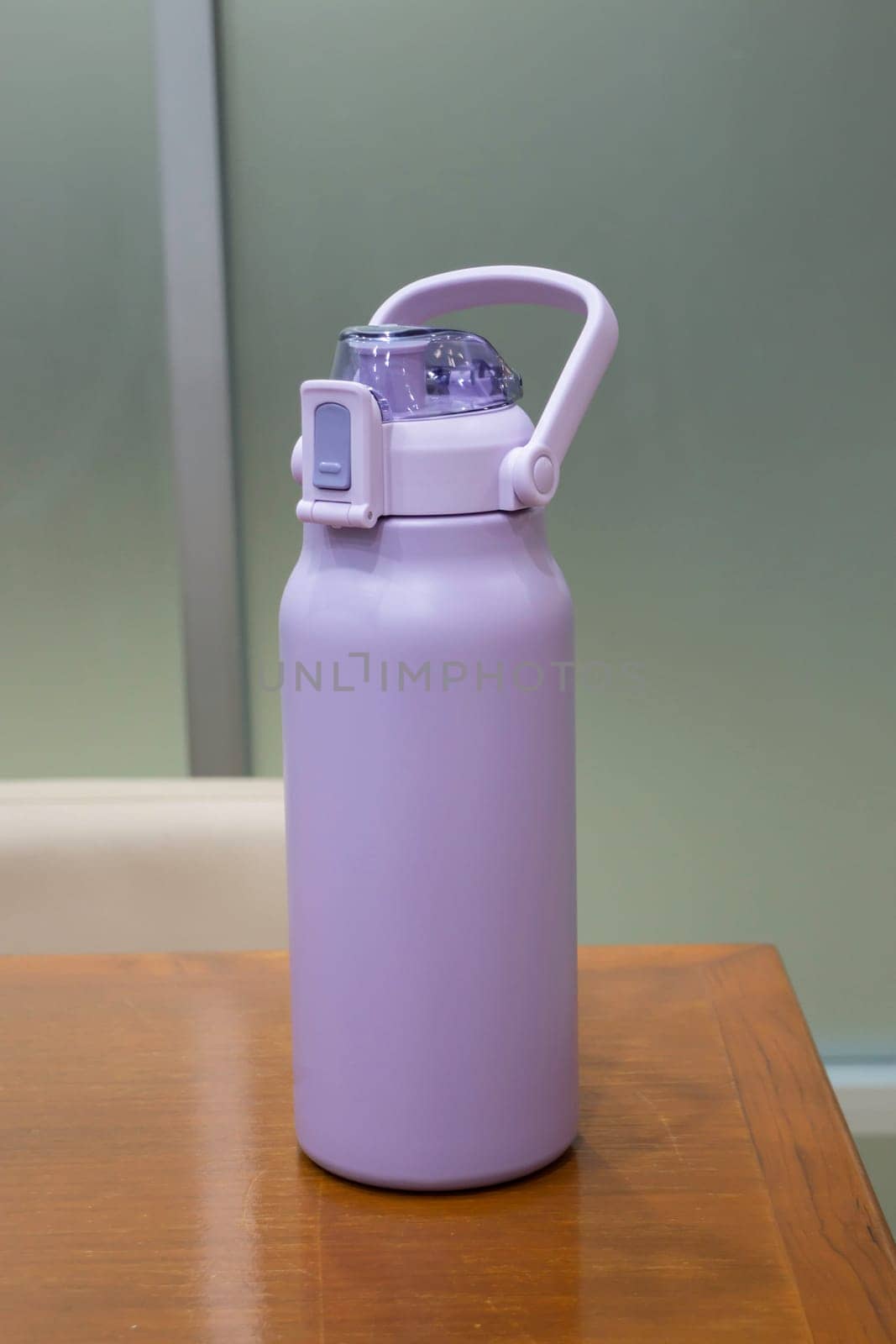 Thermos for preservation of a hot or cold drink water bottle, stock photo