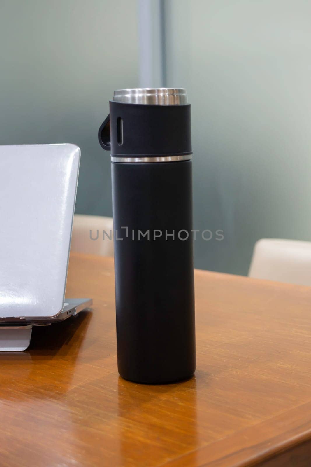 Thermos for preservation of a hot or cold drink water bottle, stock photo