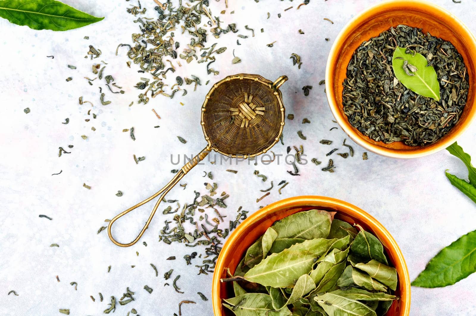 Healthy bay leaf tea and vintage tea sieve. Natural herbal medicine. Aromatic spice. Top view