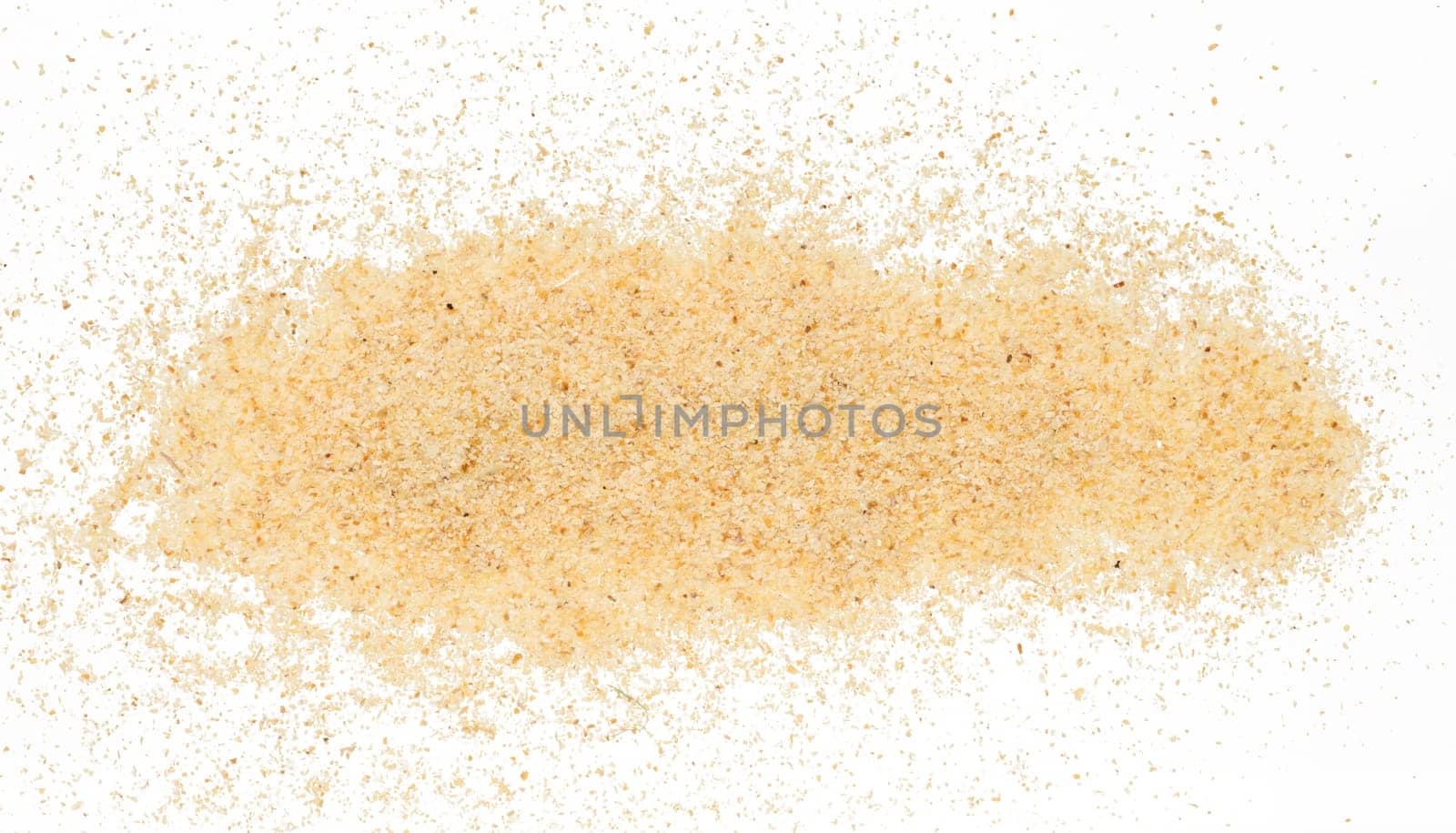 Raw wheat cereal scattered, white background
