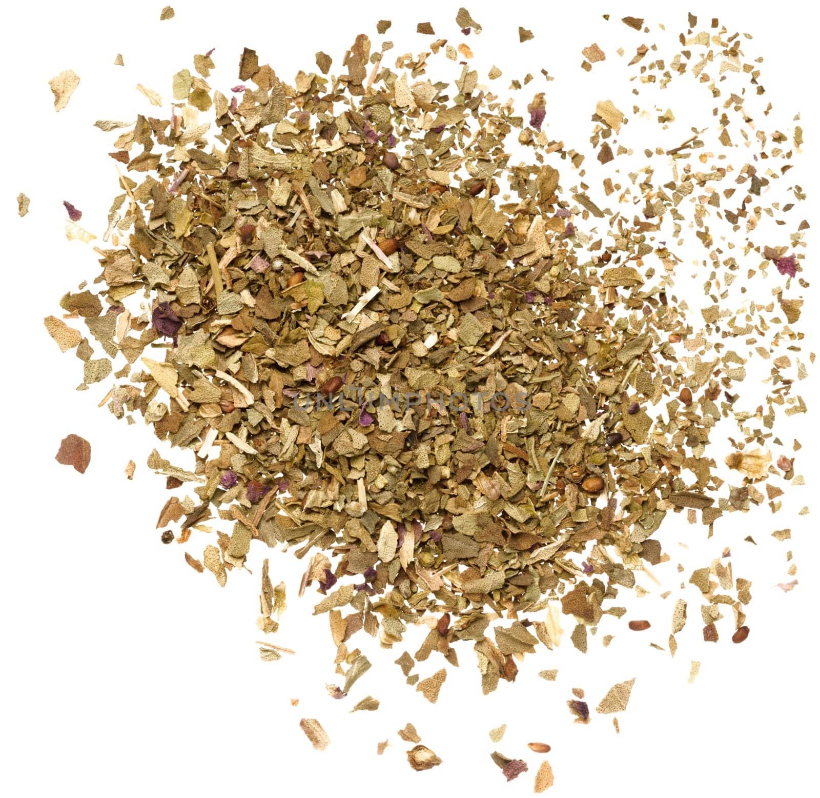 Crushed dry basil leaves on isolated background, top view