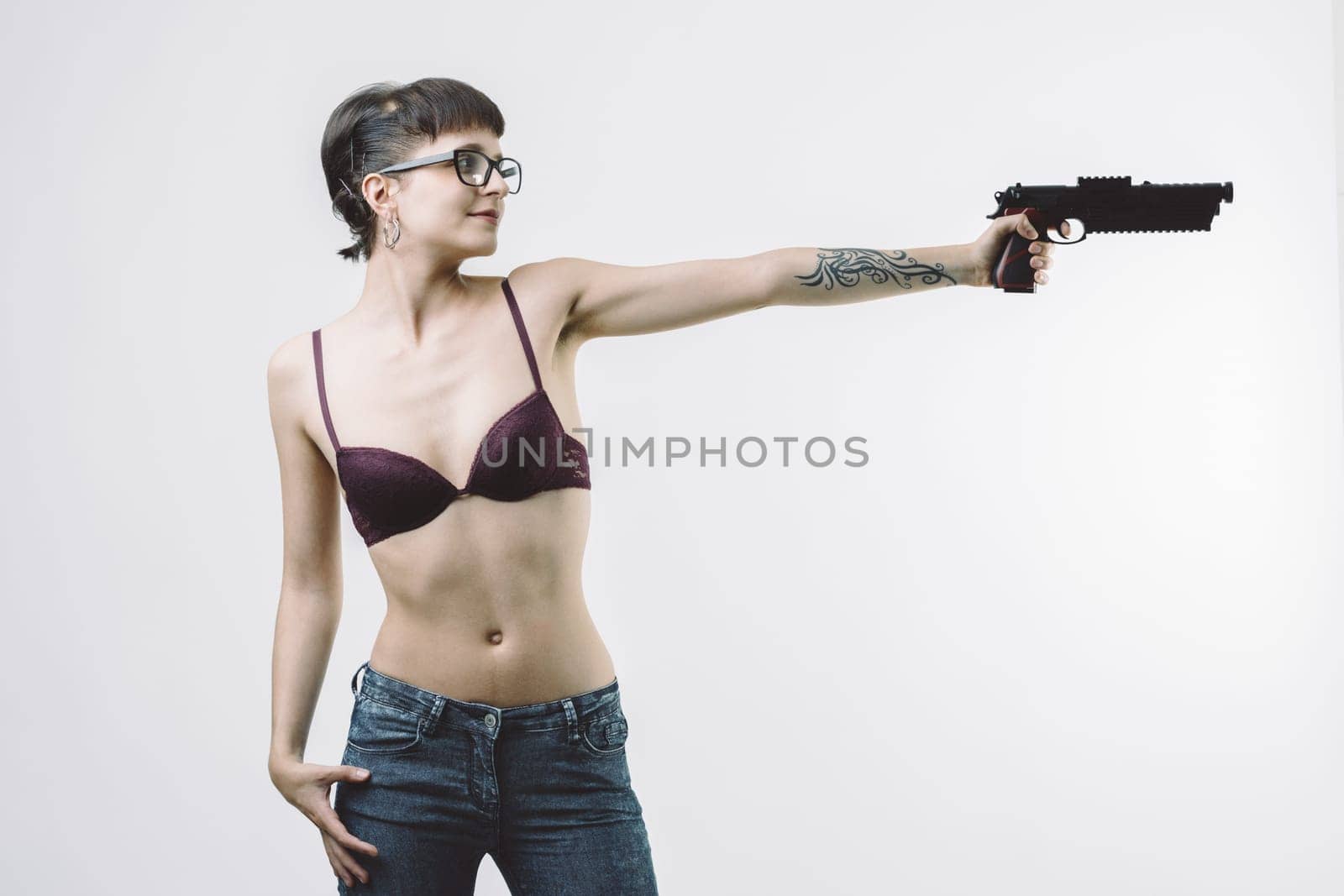 woman in lingerie, holding a gun, embodies the trope of the seductive and lethal spy or vigilante. Her composed stance and focused look add depth to this dangerous yet alluring image