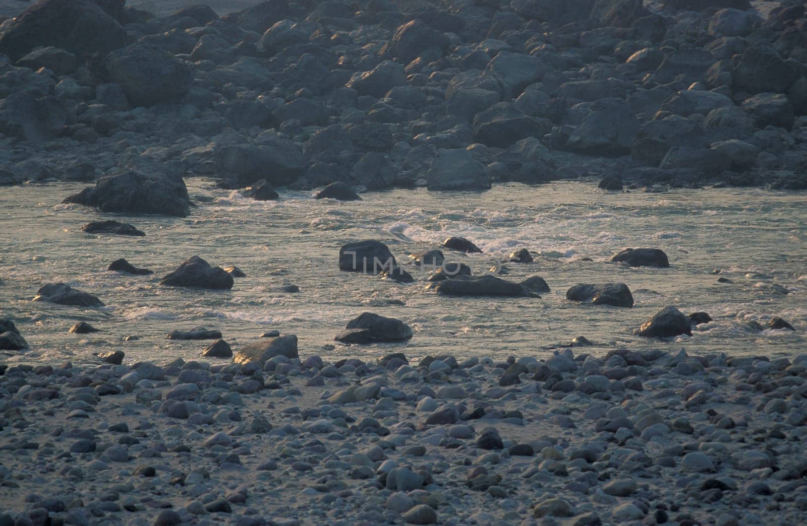 the Holy Ganges River in the city of Rishikesh in the Province Uttarakhand in India.  India, Rishikesh, February, 1998