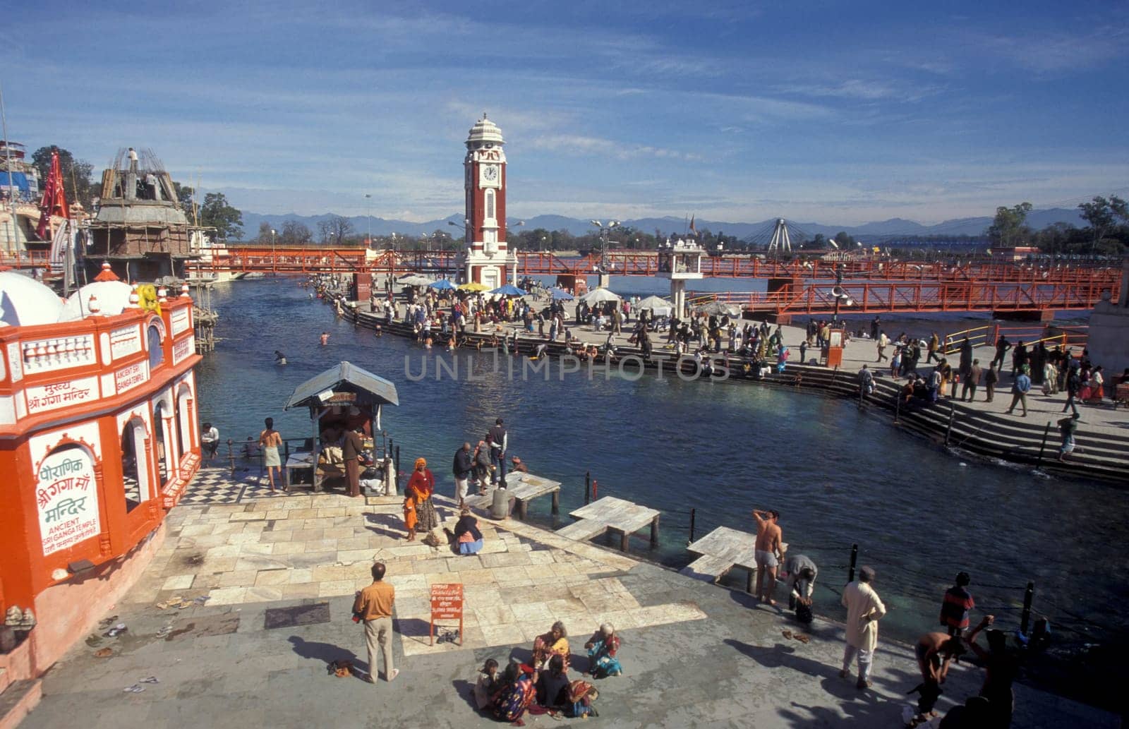 a view over public aerea with the Clock Tower at the Holy Ganges River in the city of Haridwar in the Province Uttarakhand in India.  India, Haridwar, February, 1998
