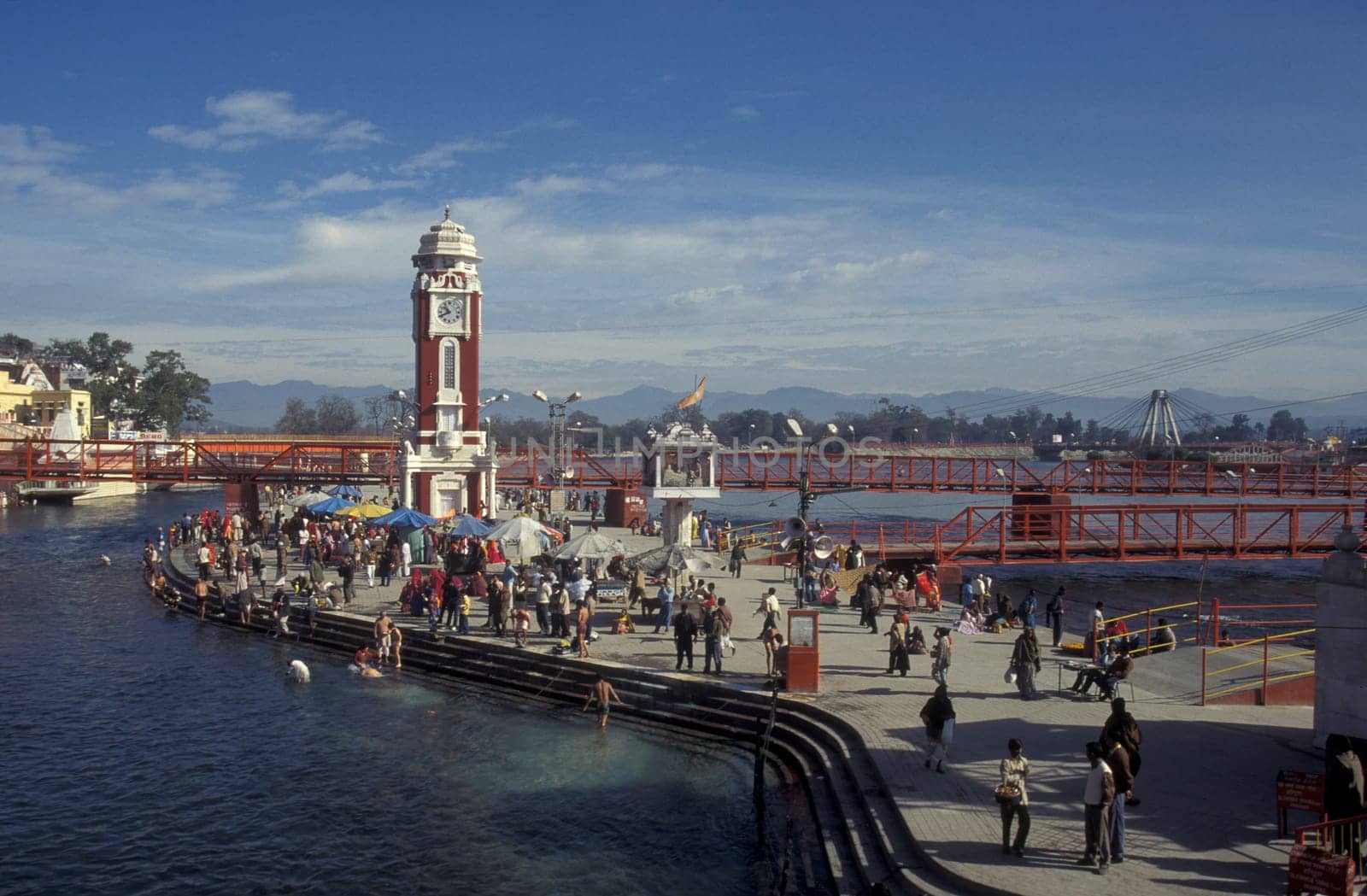 a view over public aerea with the Clock Tower at the Holy Ganges River in the city of Haridwar in the Province Uttarakhand in India.  India, Haridwar, February, 1998