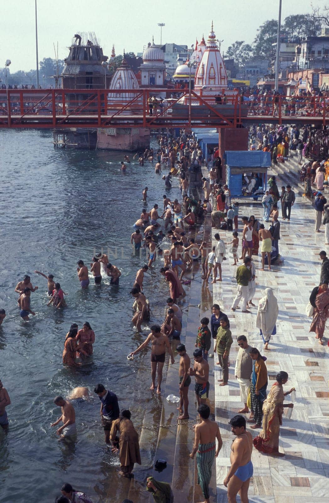 Hindi Pilgrim take a Bath in the Ganges River in the city of Haridwar in the Province Uttarakhand in India.  India, Haridwar, April, 1998