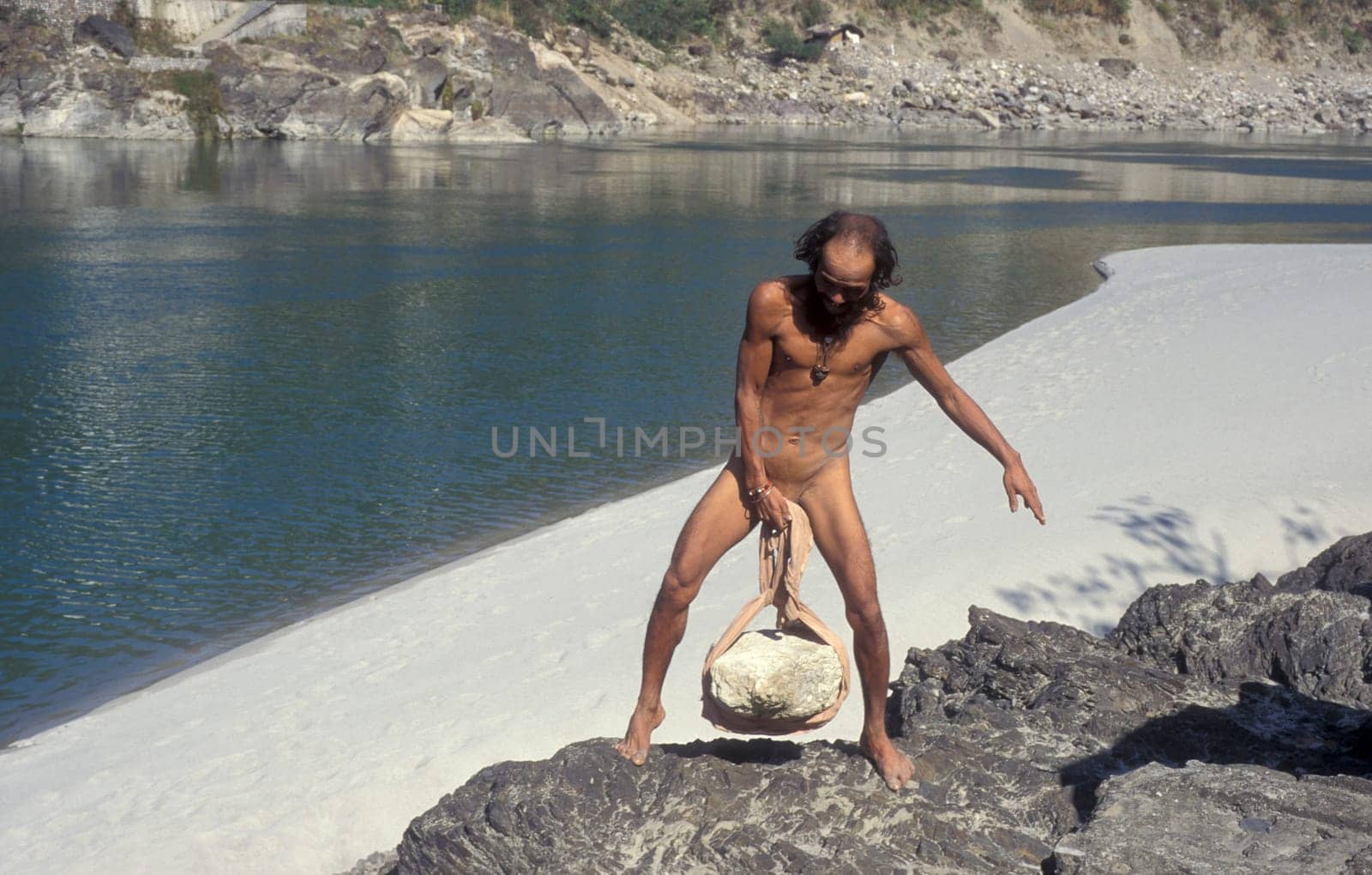 a Holy men and Street Sadhus at the Holy Ganges River in the city of Rishikesh in the Province Uttarakhand in India.  India, Rishikesh, February, 1998
