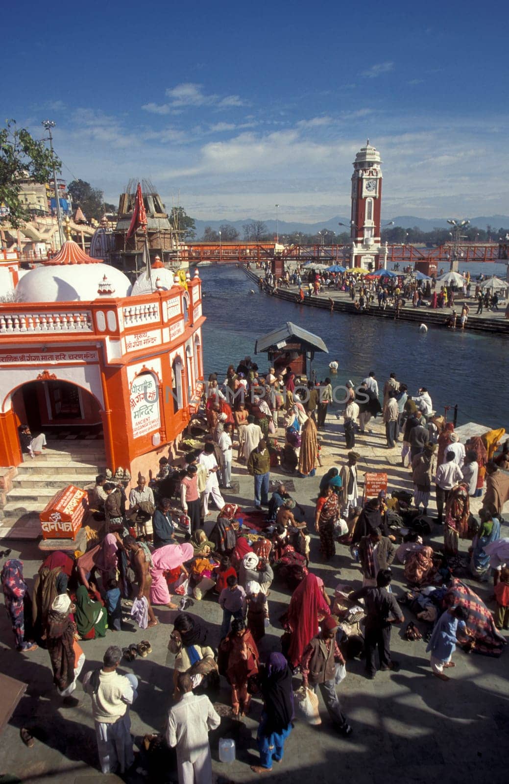a view over public aerea with the Clock Tower at the Holy Ganges River in the city of Haridwar in the Province Uttarakhand in India.  India, Haridwar, February, 1998