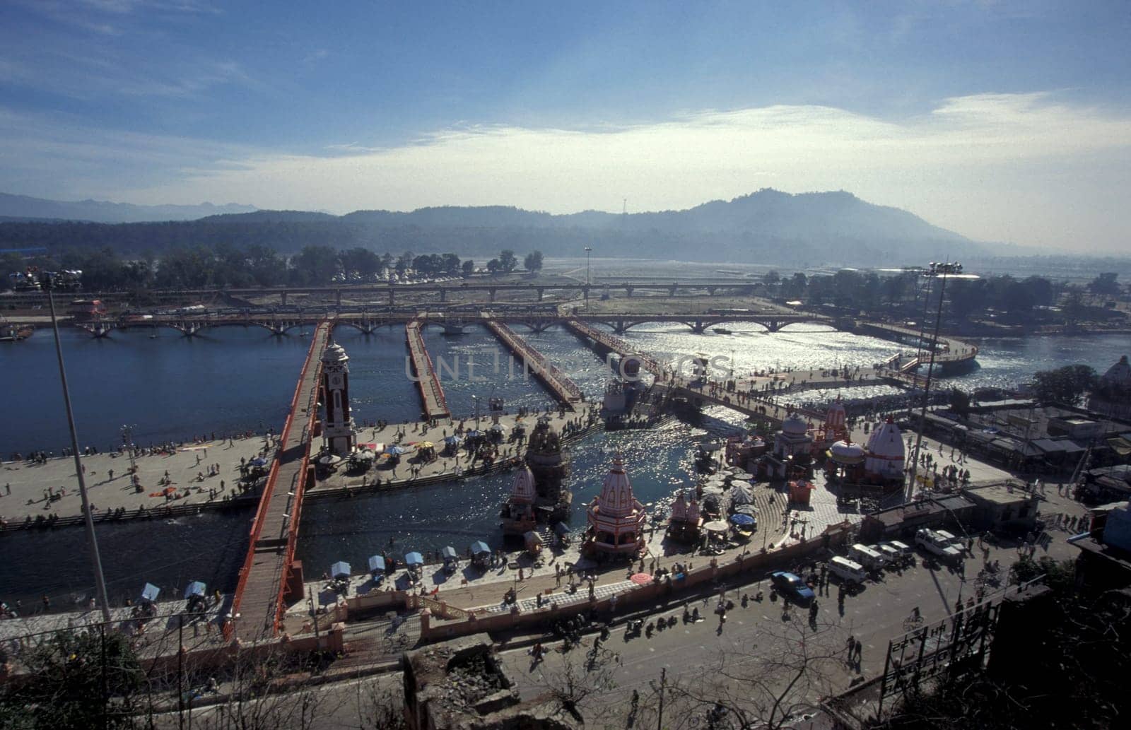 a view over public aerea with the Clock Tower at the Holy Ganges River in the city of Haridwar in the Province Uttarakhand in India.  India, Haridwar, February, 1998