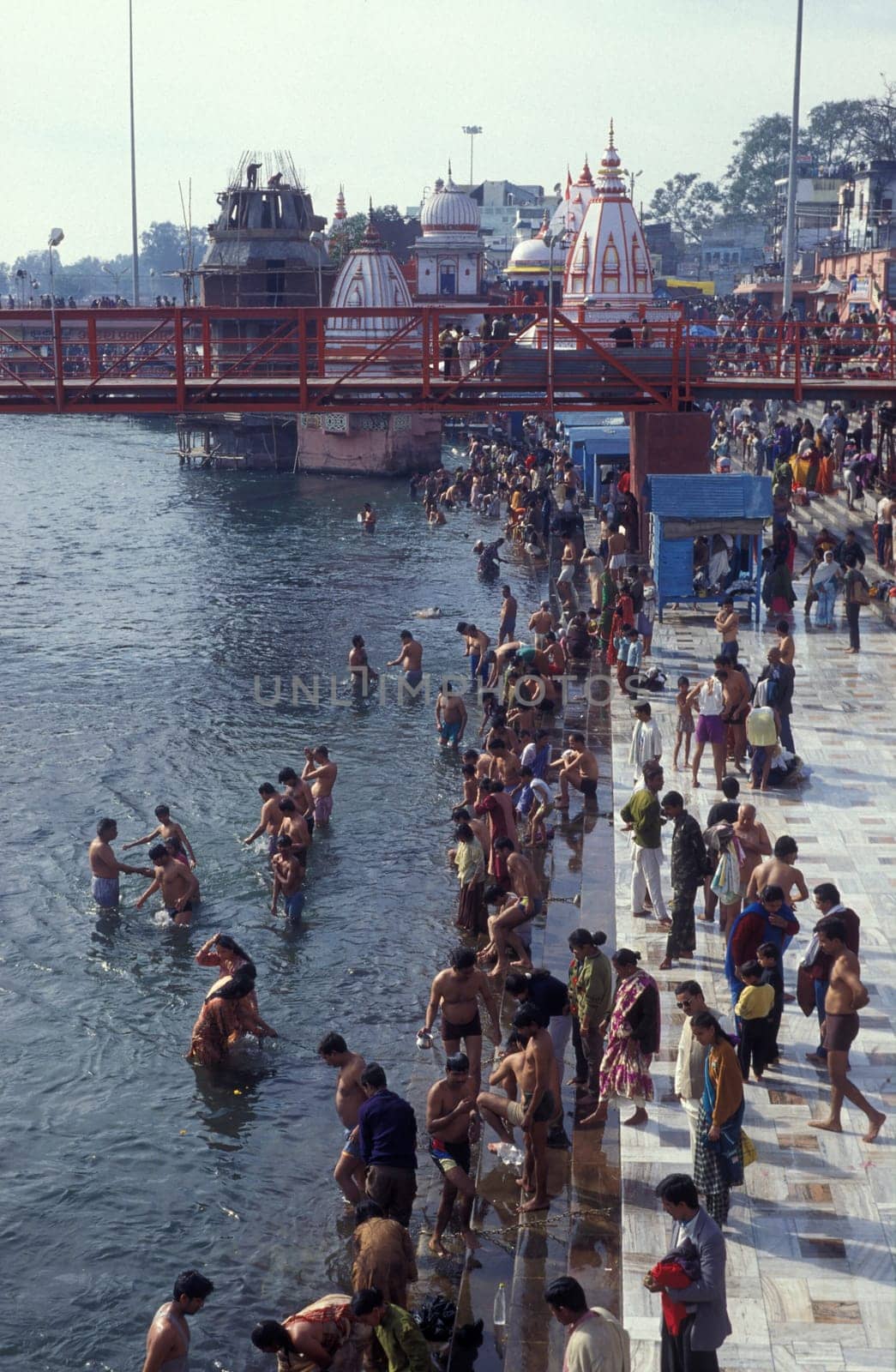 Hindi Pilgrim take a Bath in the Ganges River in the city of Haridwar in the Province Uttarakhand in India.  India, Haridwar, April, 1998
