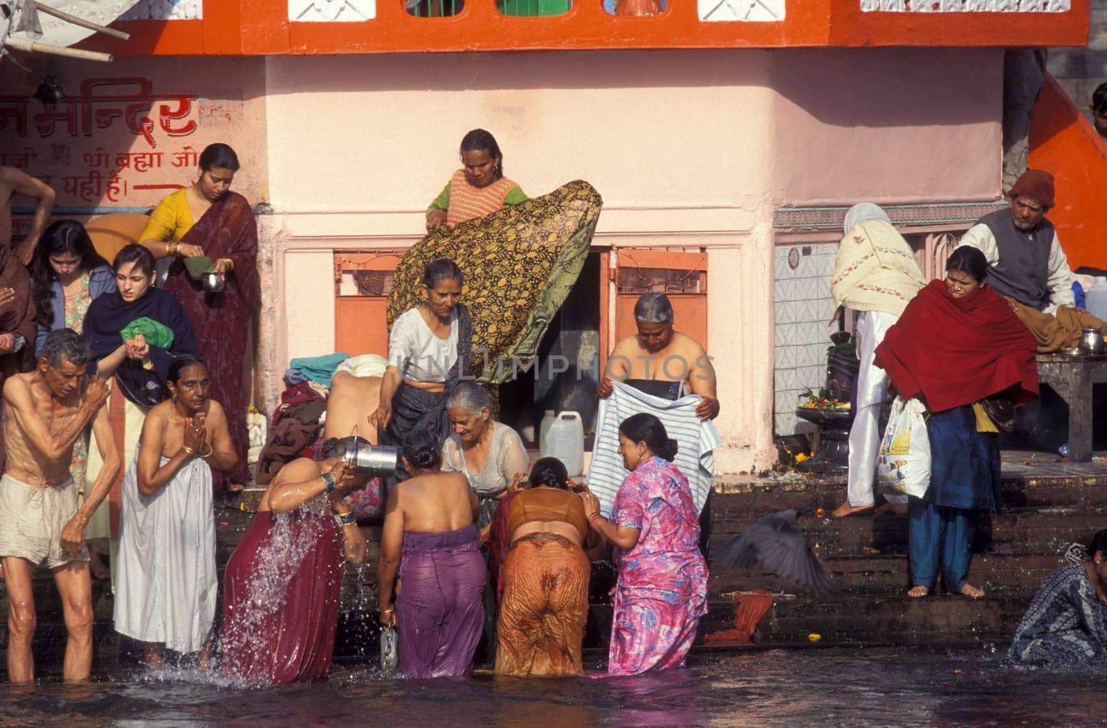 Hindi Pilgrim take a Bath in the Ganges River in the city of Haridwar in the Province Uttarakhand in India.  India, Haridwar, April, 1998