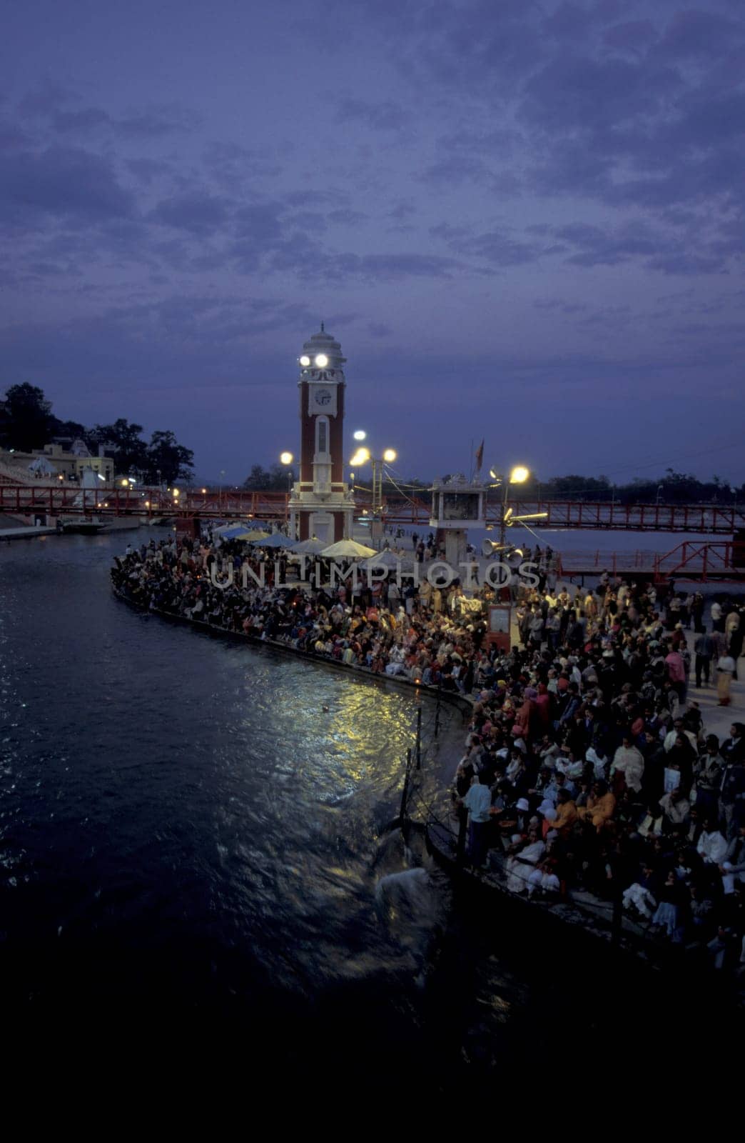 a view over public aerea with the Clock Tower at the Holy Ganges River in the city of Haridwar in the Province Uttarakhand in India.  India, Haridwar, February, 1998