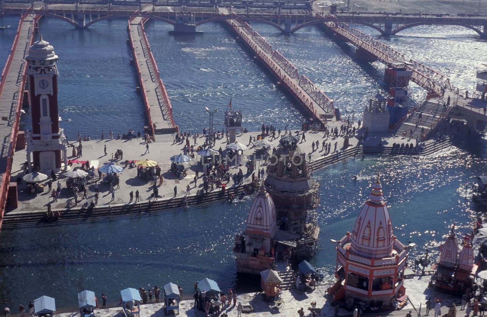 a view over public aerea with the Clock Tower at the Holy Ganges River in the city of Haridwar in the Province Uttarakhand in India.  India, Haridwar, February, 1998
