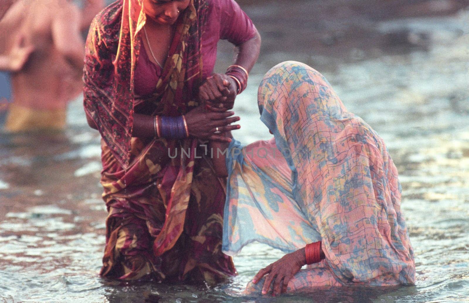 Hindi Pilgrim take a Bath in the Ganges River in the city of Haridwar in the Province Uttarakhand in India.  India, Haridwar, February, 1998