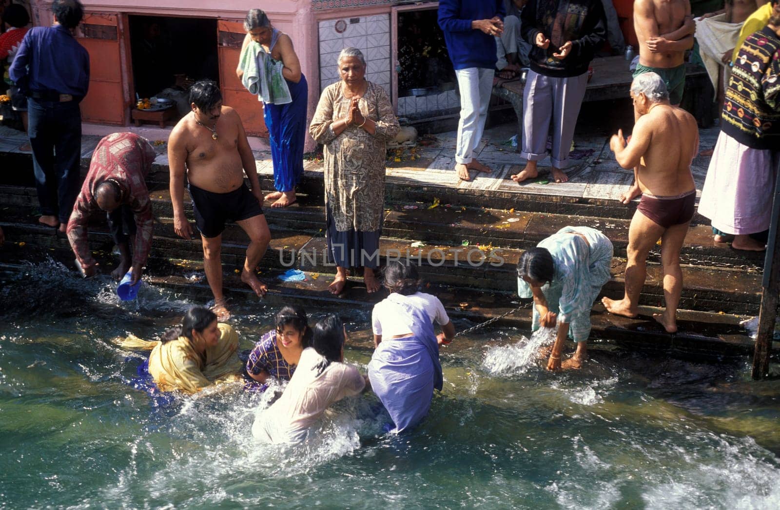 Hindi Pilgrim take a Bath in the Ganges River in the city of Haridwar in the Province Uttarakhand in India.  India, Haridwar, February, 1998