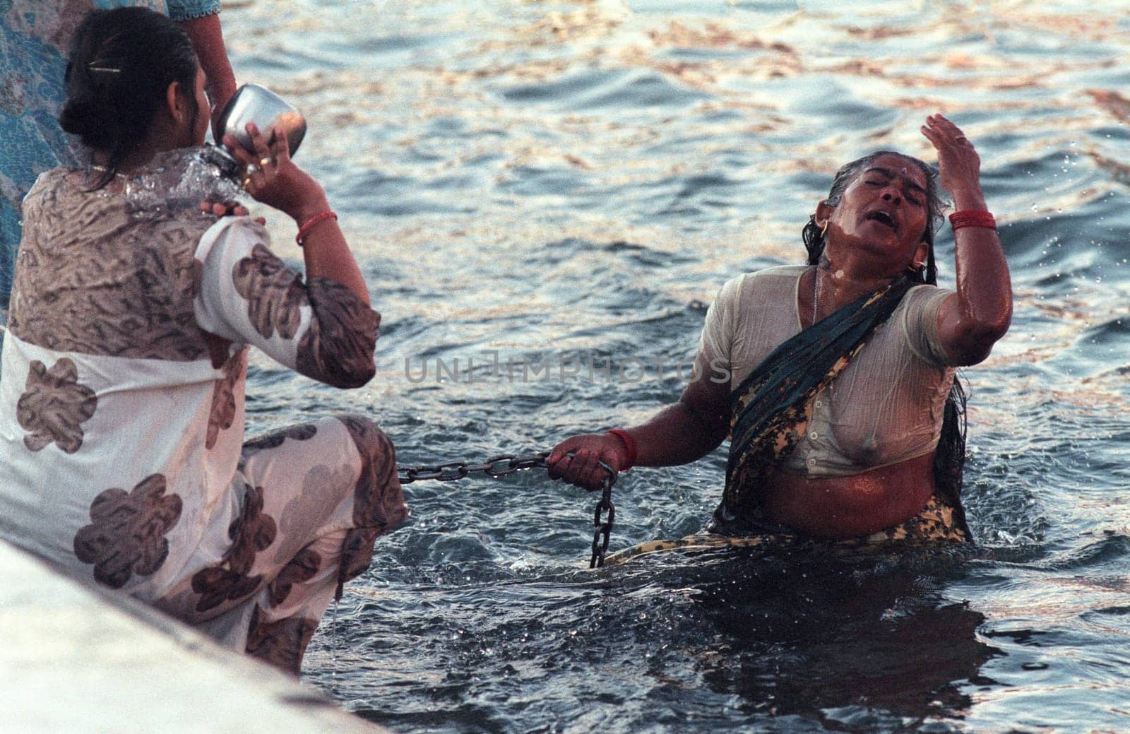 Hindi Pilgrim take a Bath in the Ganges River in the city of Haridwar in the Province Uttarakhand in India.  India, Haridwar, February, 1998
