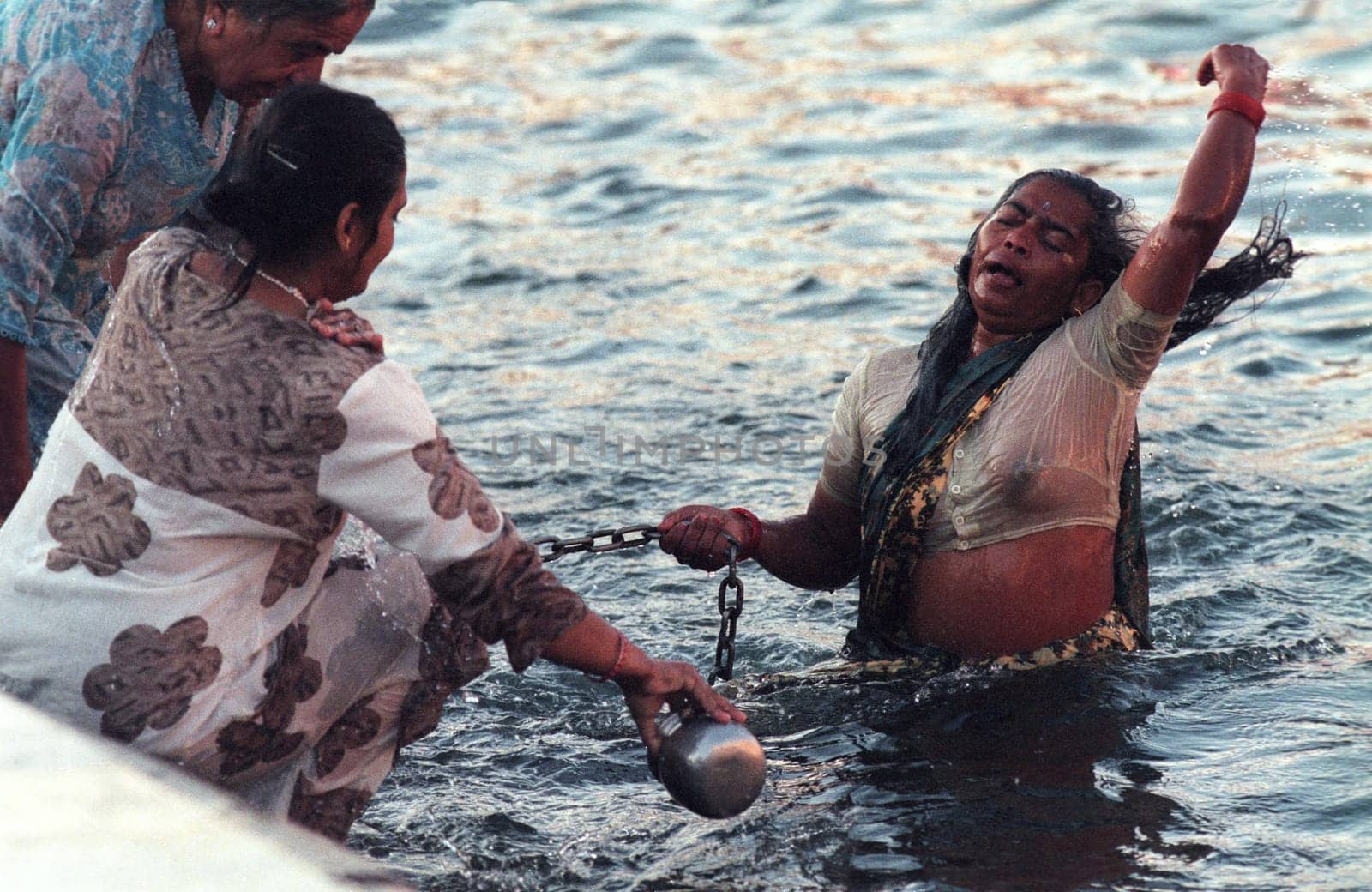 Hindi Pilgrim take a Bath in the Ganges River in the city of Haridwar in the Province Uttarakhand in India.  India, Haridwar, February, 1998